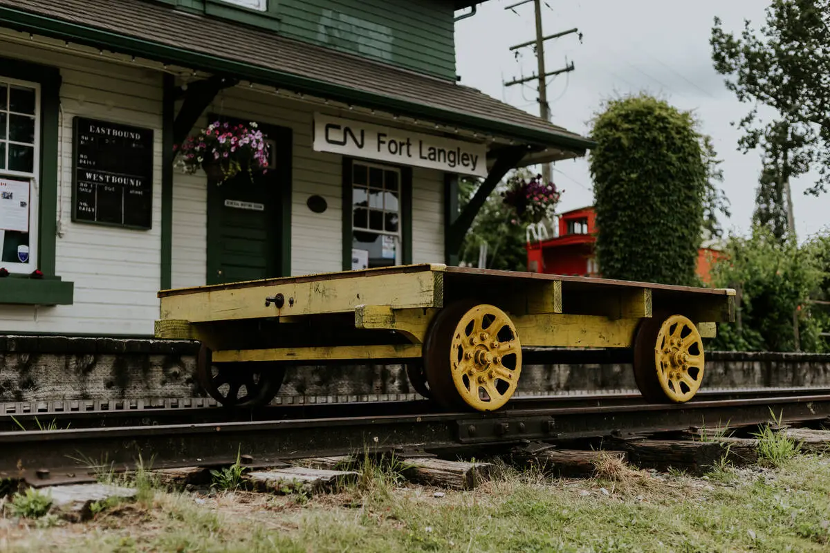 CN Fort Langley train station sign with rail trolley.