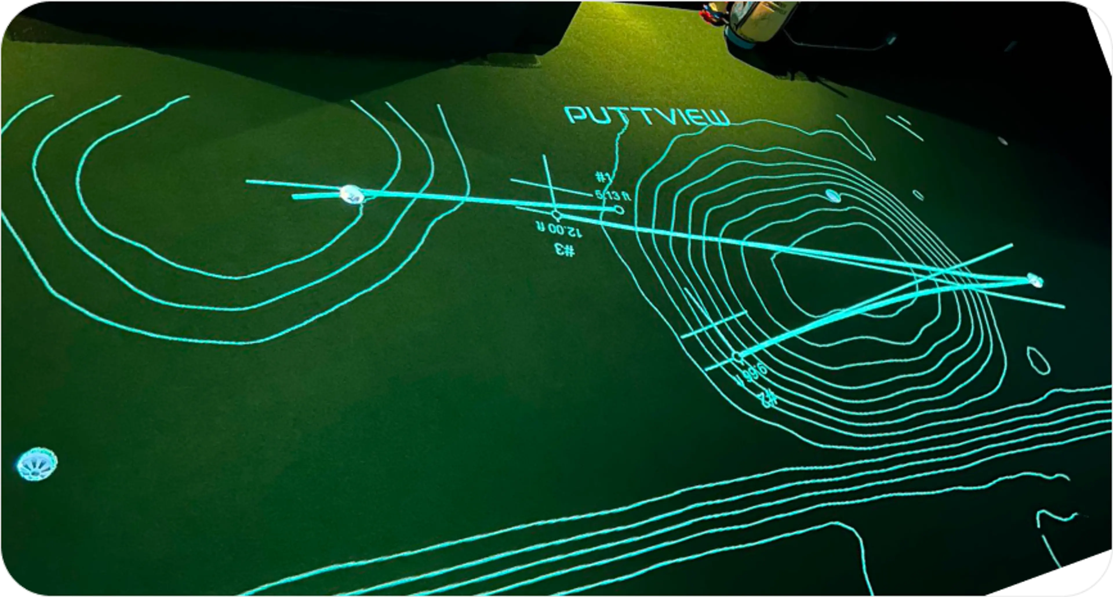 A projected model of topography and golf putt trajectory on an indoor golf green at Ultimate Golf Lounge in Vancouver.