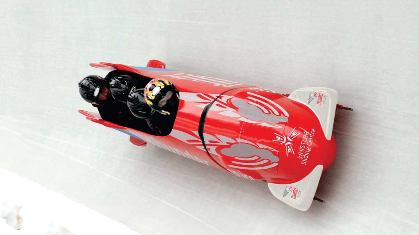People riding in a bob sled at the Whistler Sliding Centre