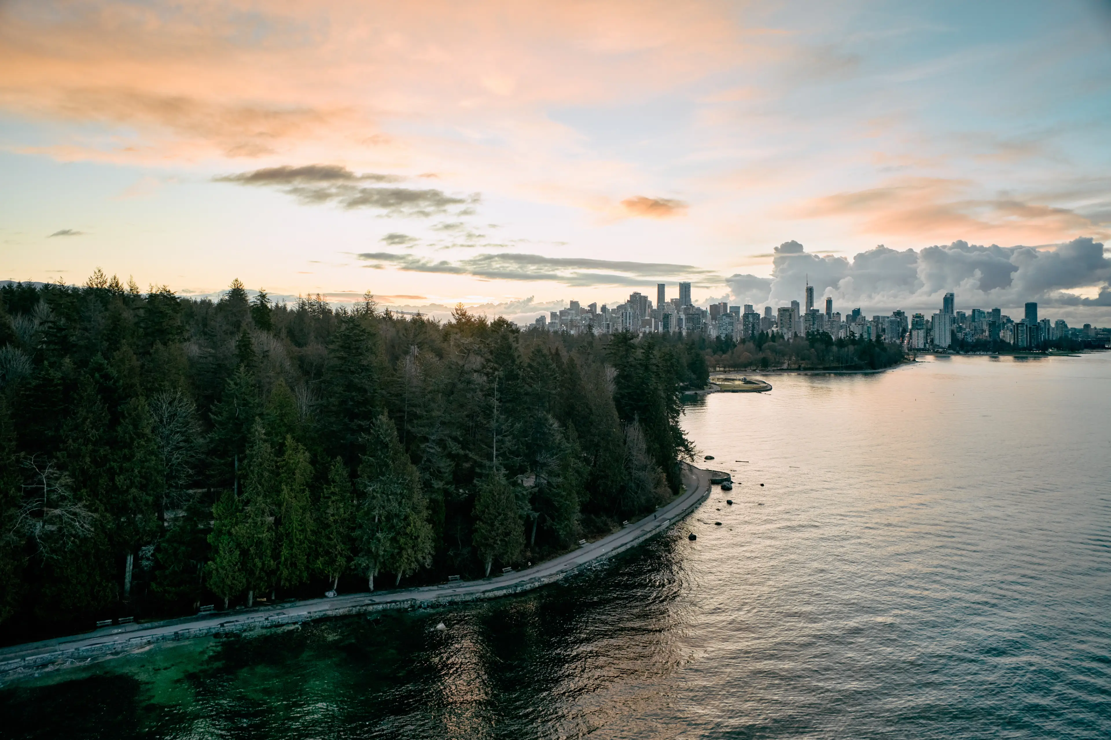 A scenic image of the Stanley Park Seawall at dusk.