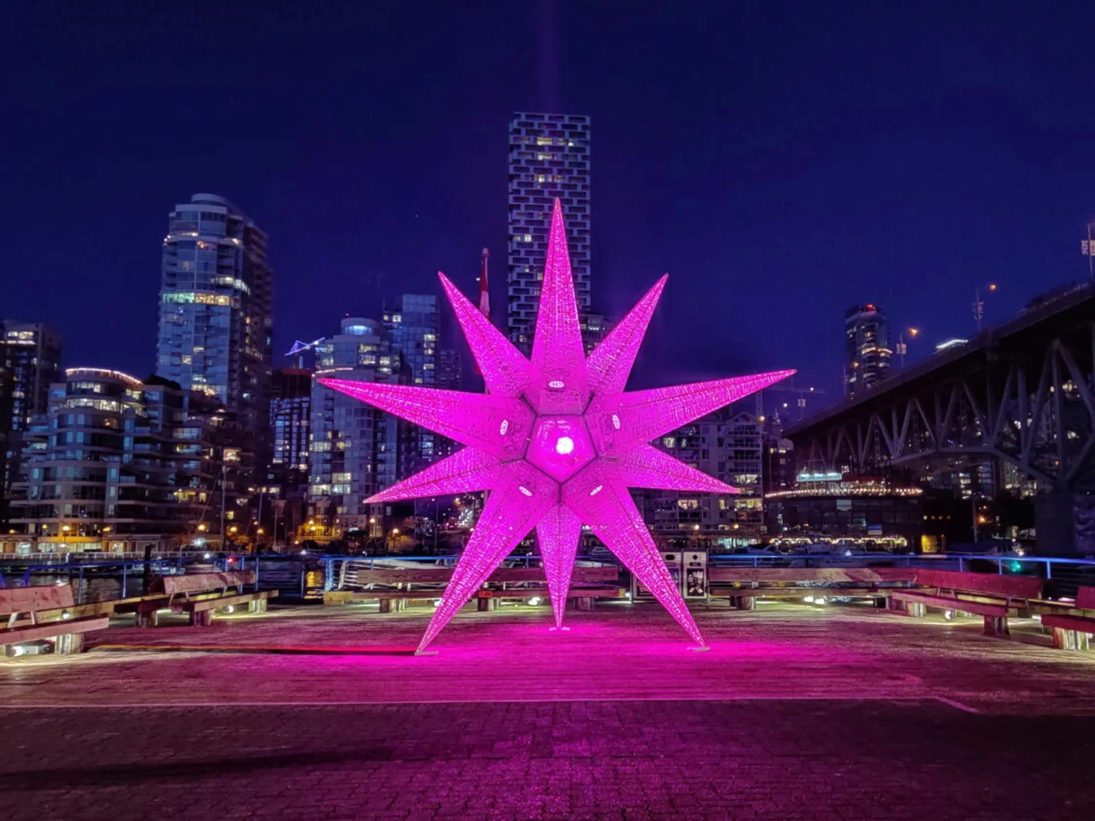 A huge, illuminated holiday star in the courtyard of the Public Market at Granville Island
