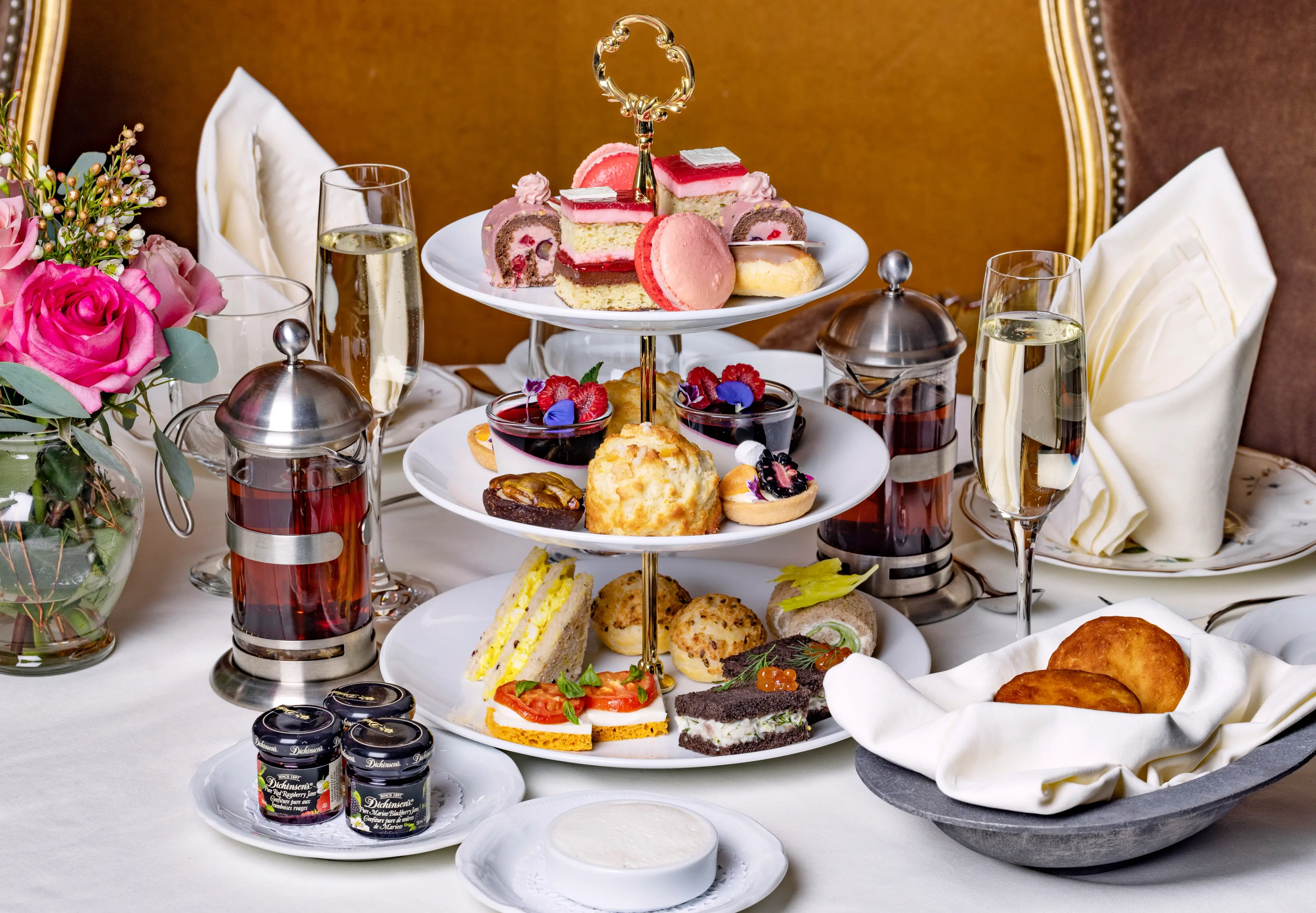 A three-tiered tray of sweet and savoury items at the Valentine's-themed afternoon tea at Bacchus in Vancouver