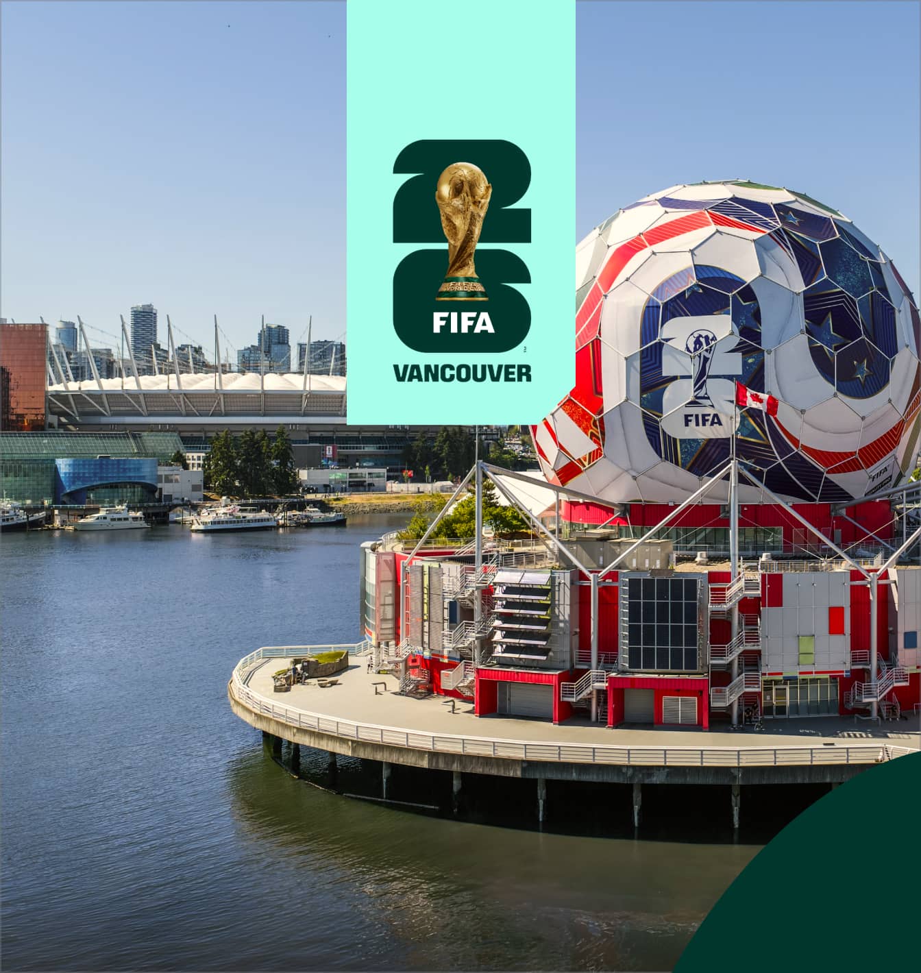 Large soccer ball structure with FIFA 2026 logo on waterfront in Vancouver, with stadium and city skyline in background.