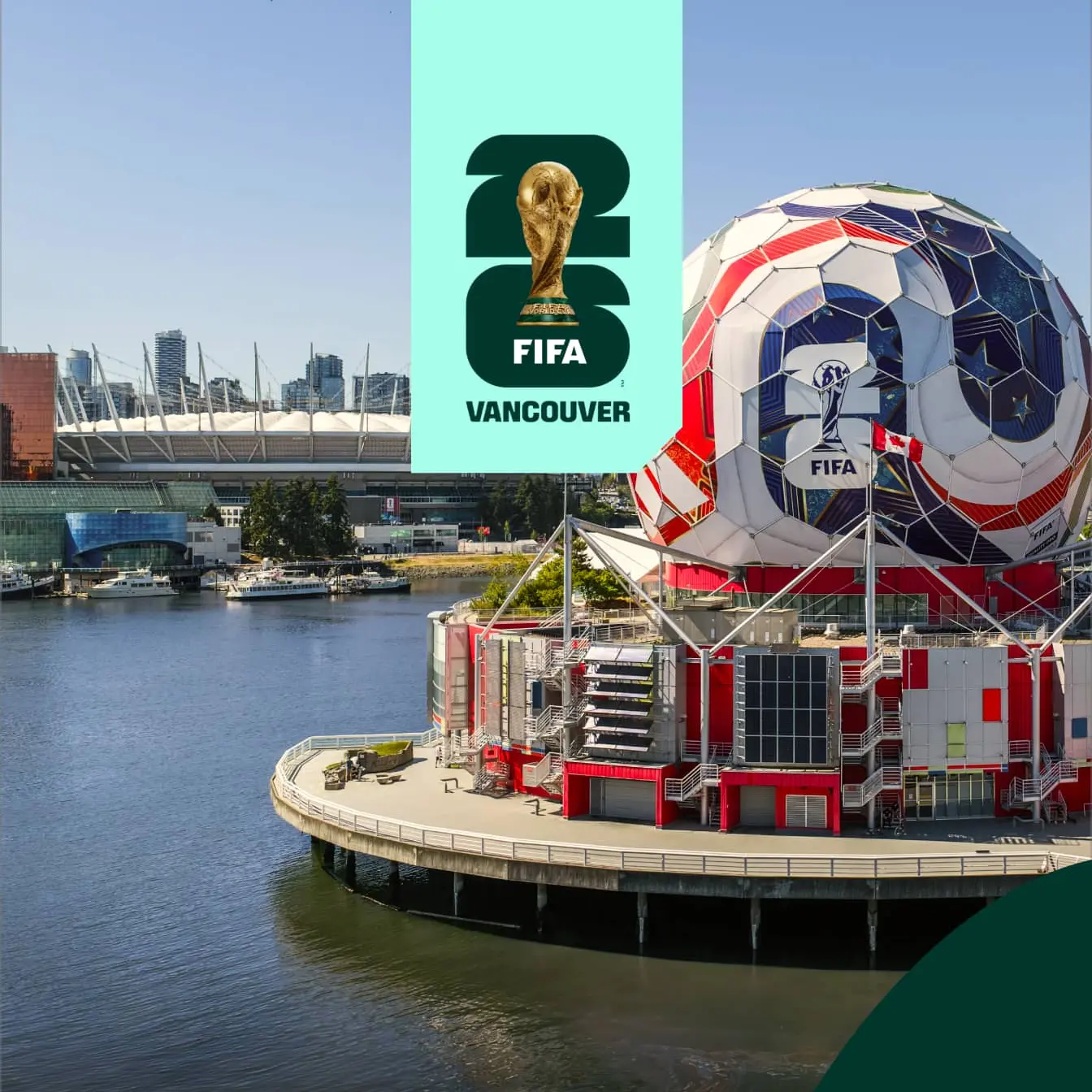 Large soccer ball structure with FIFA 2026 logo on waterfront in Vancouver, with stadium and city skyline in background.