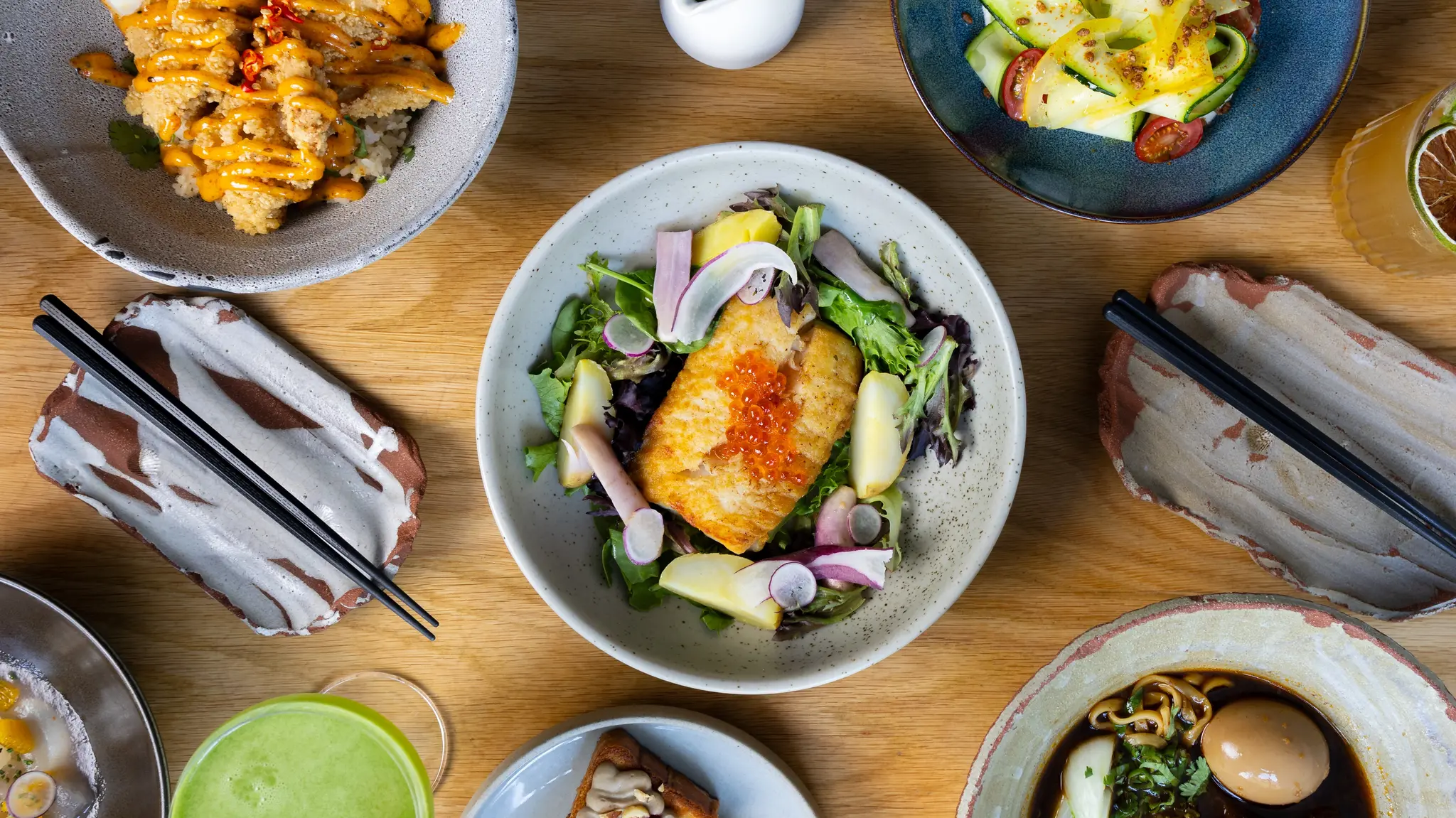 A variety of different Asian dishes on a table.