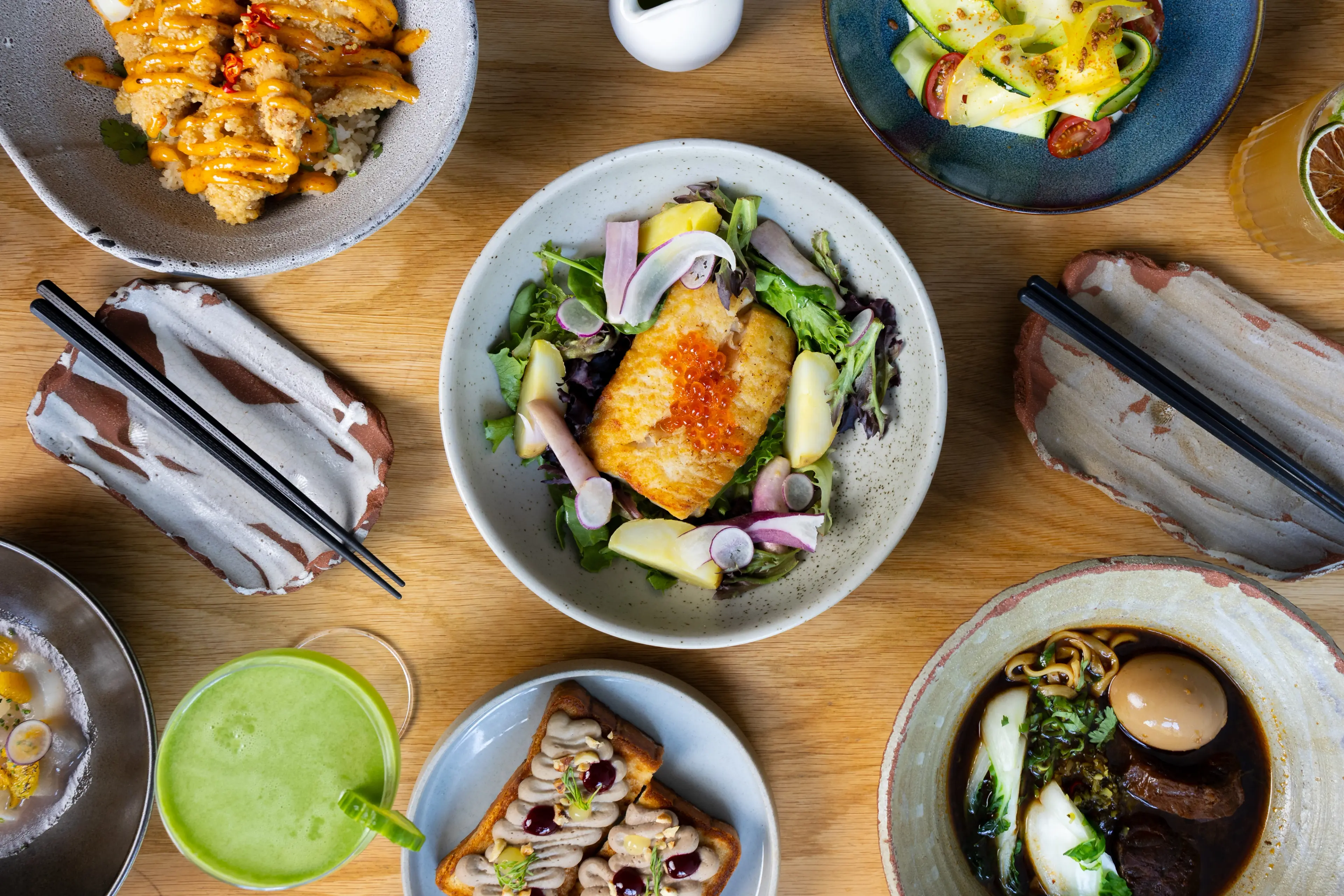 A variety of different Asian dishes on a table.