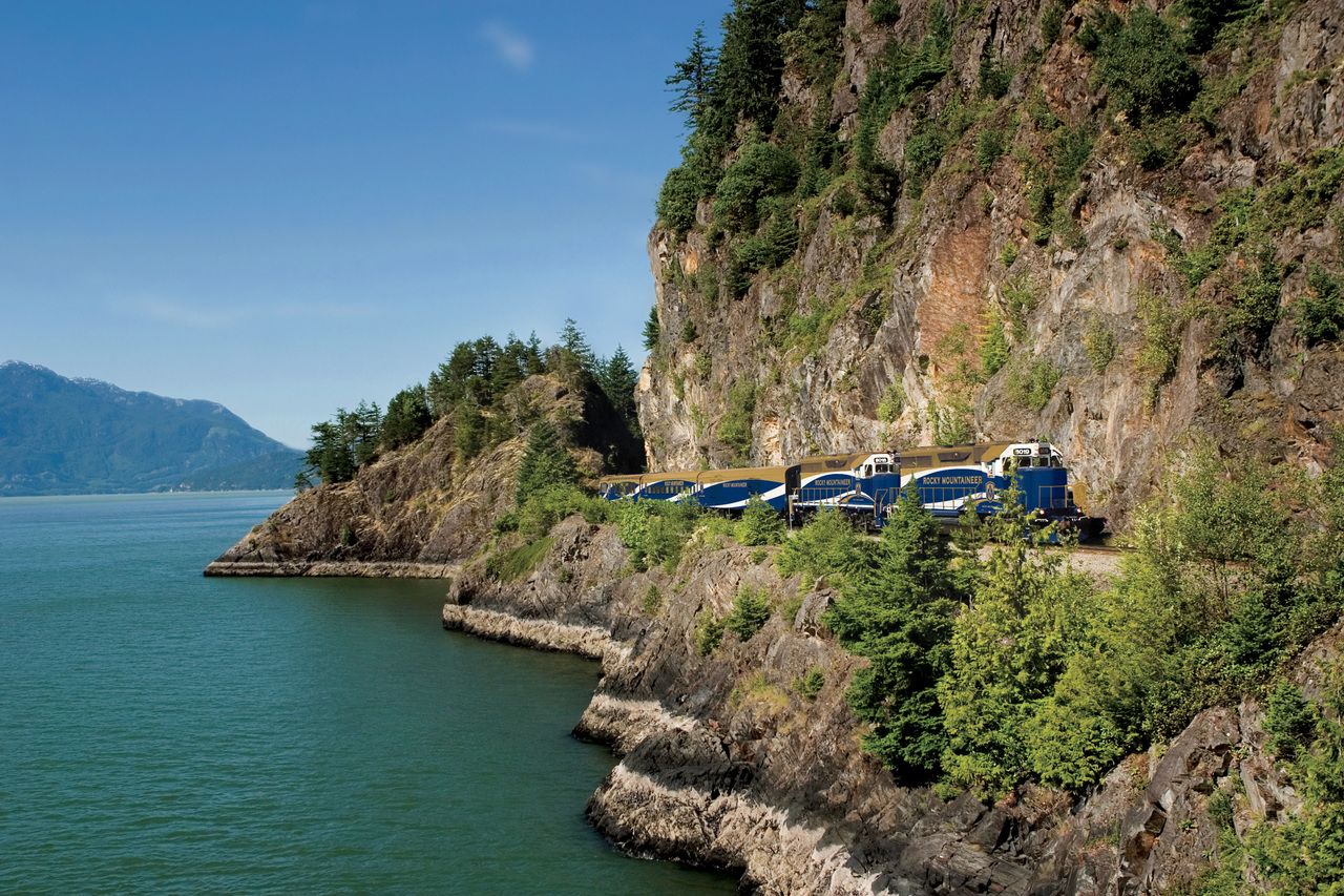 Rocky Mountaineer train travelling along Howe Sound from Whistler to Vancouver