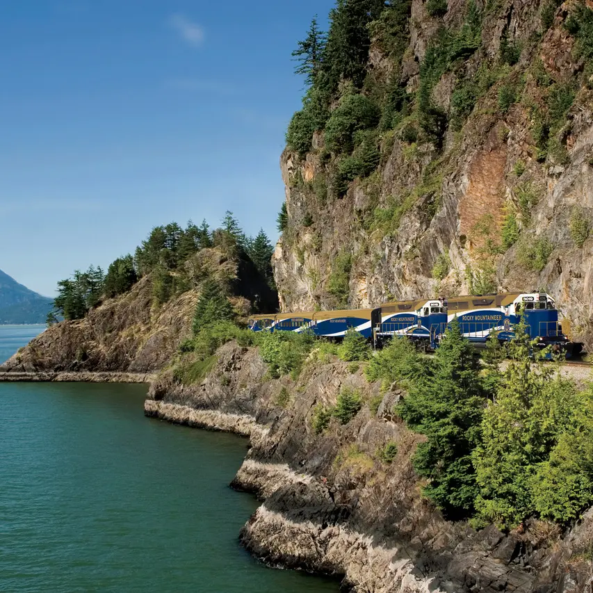 Rocky Mountaineer train travelling along Howe Sound from Whistler to Vancouver