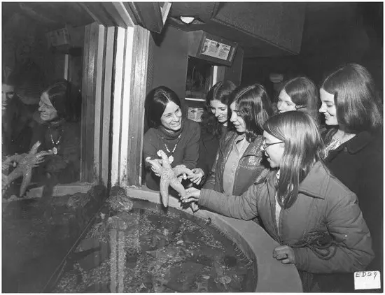 Students and visitors are engaged in hands-on learning, a tradition which continues at the Aquarium today