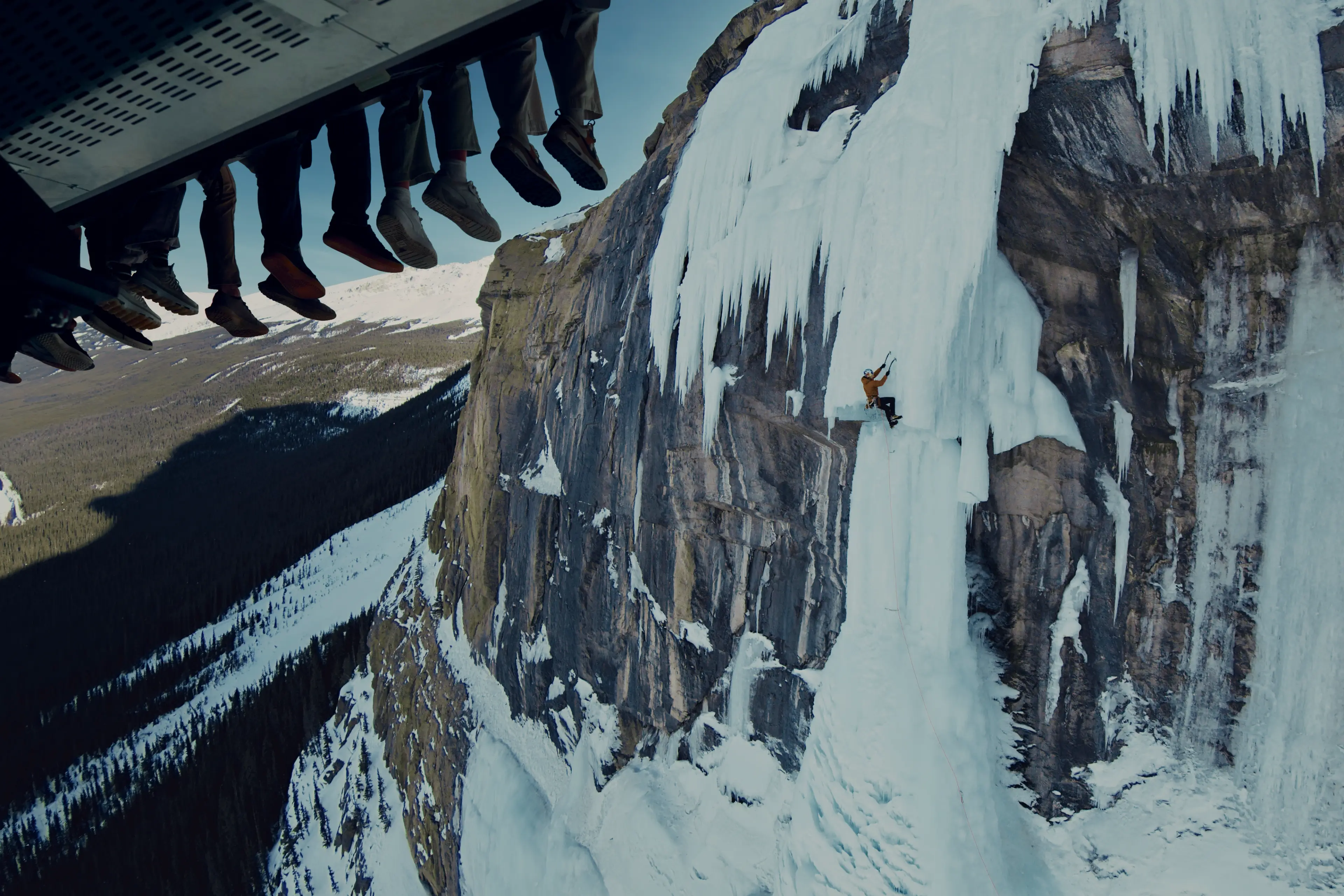 View of riders' legs and screen on Flyover journey