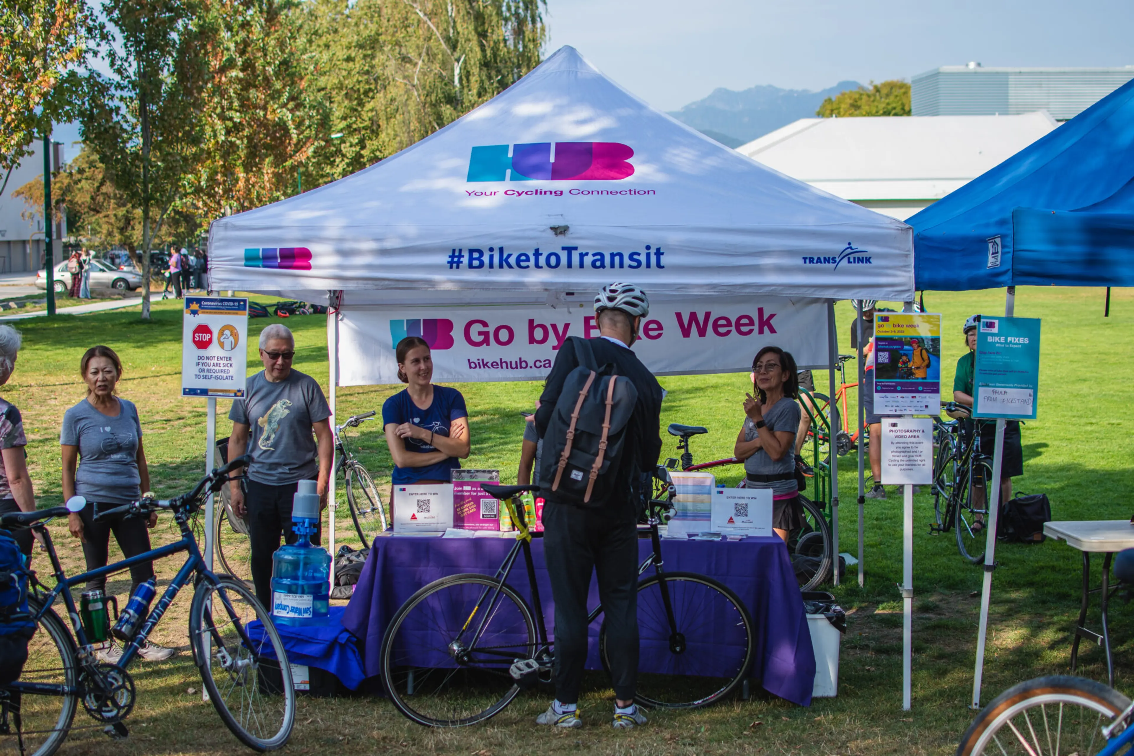 Cyclists stop at a celebration station during Vancouver's Go By Bike Week