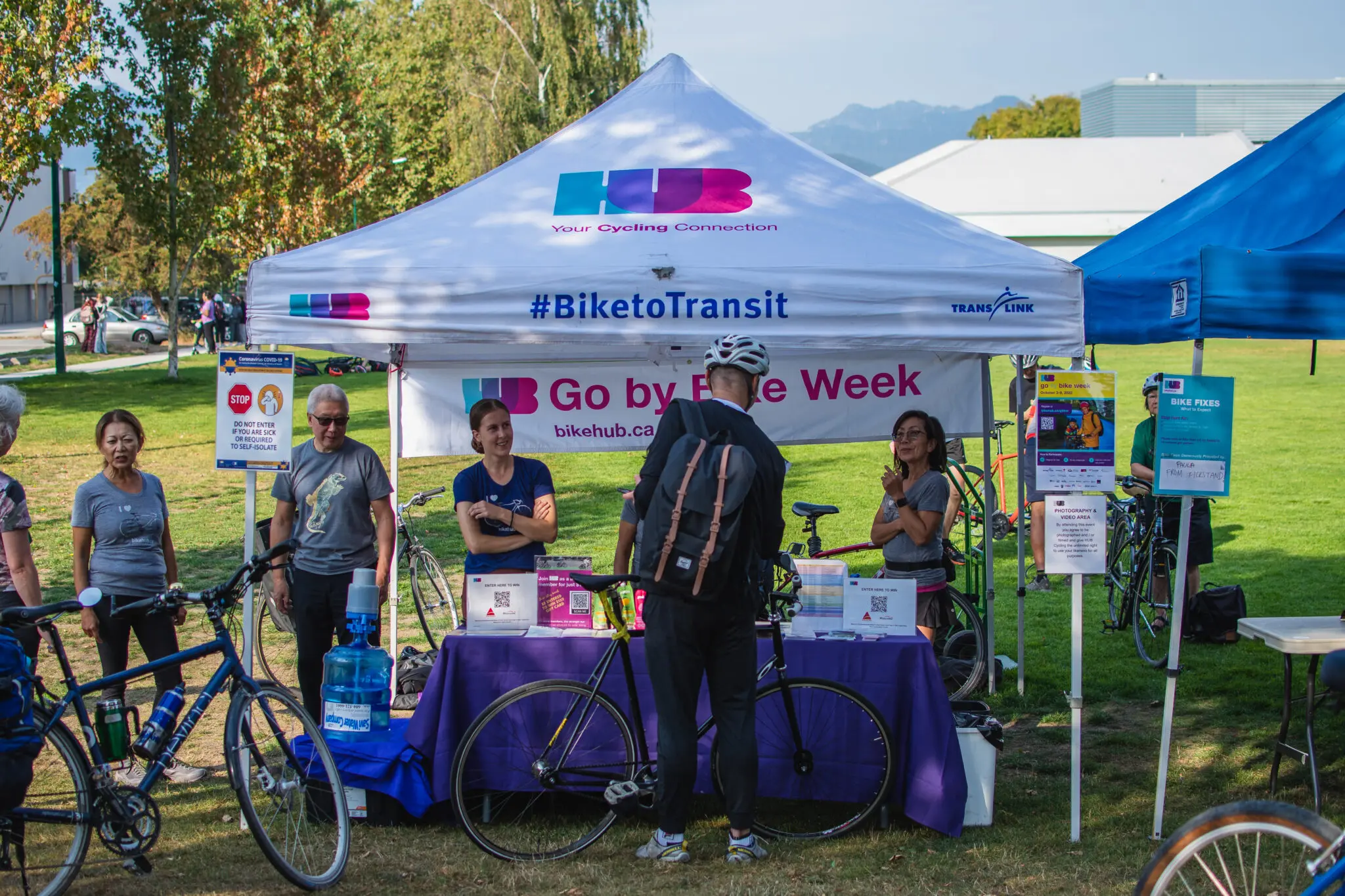 Cyclists stop at a celebration station during Vancouver's Go By Bike Week