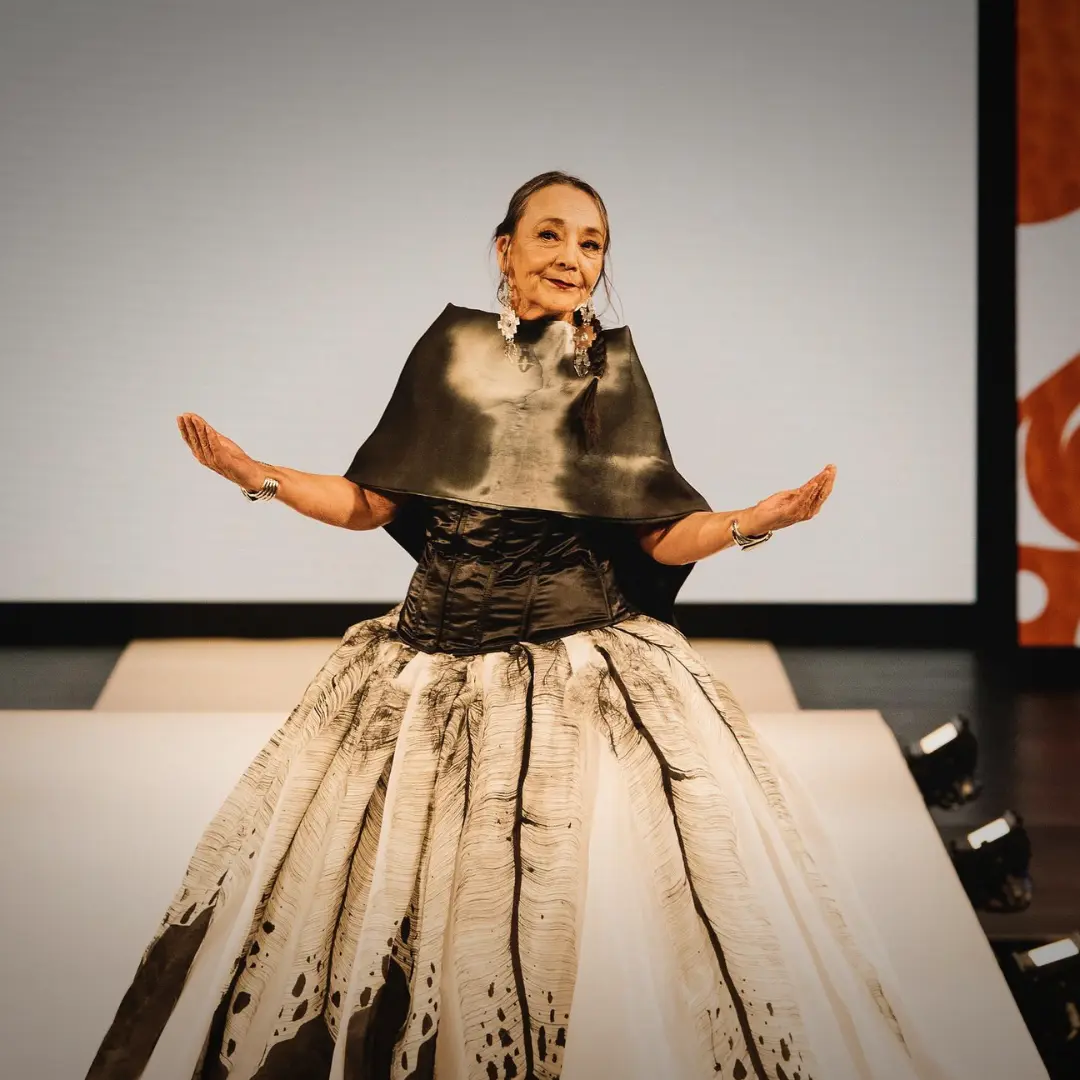 Actor Tantoo Cardinal on the runway wearing a gown by Patricia Michaels