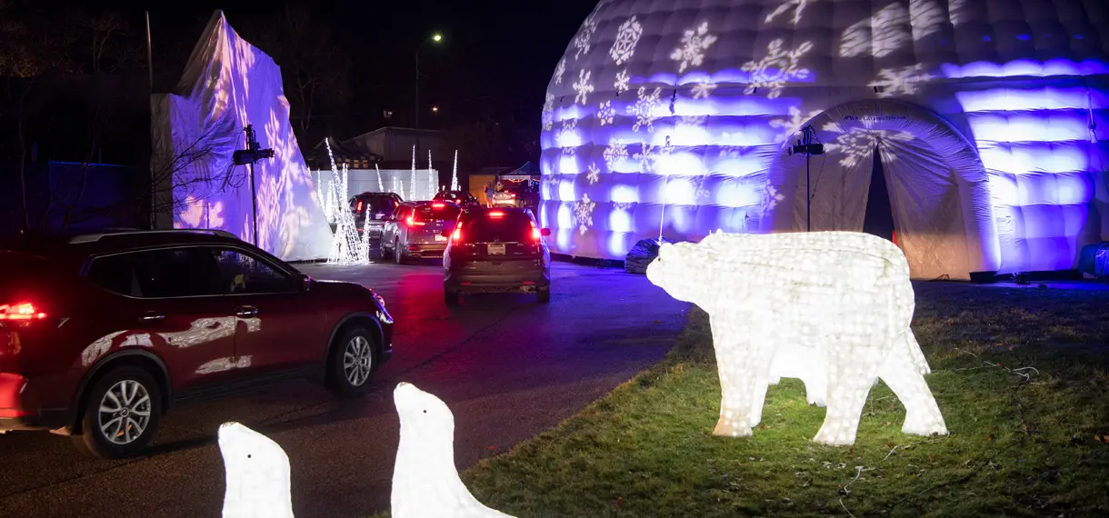 Cars drive through the PNE Winter Lights experience in Vancouver