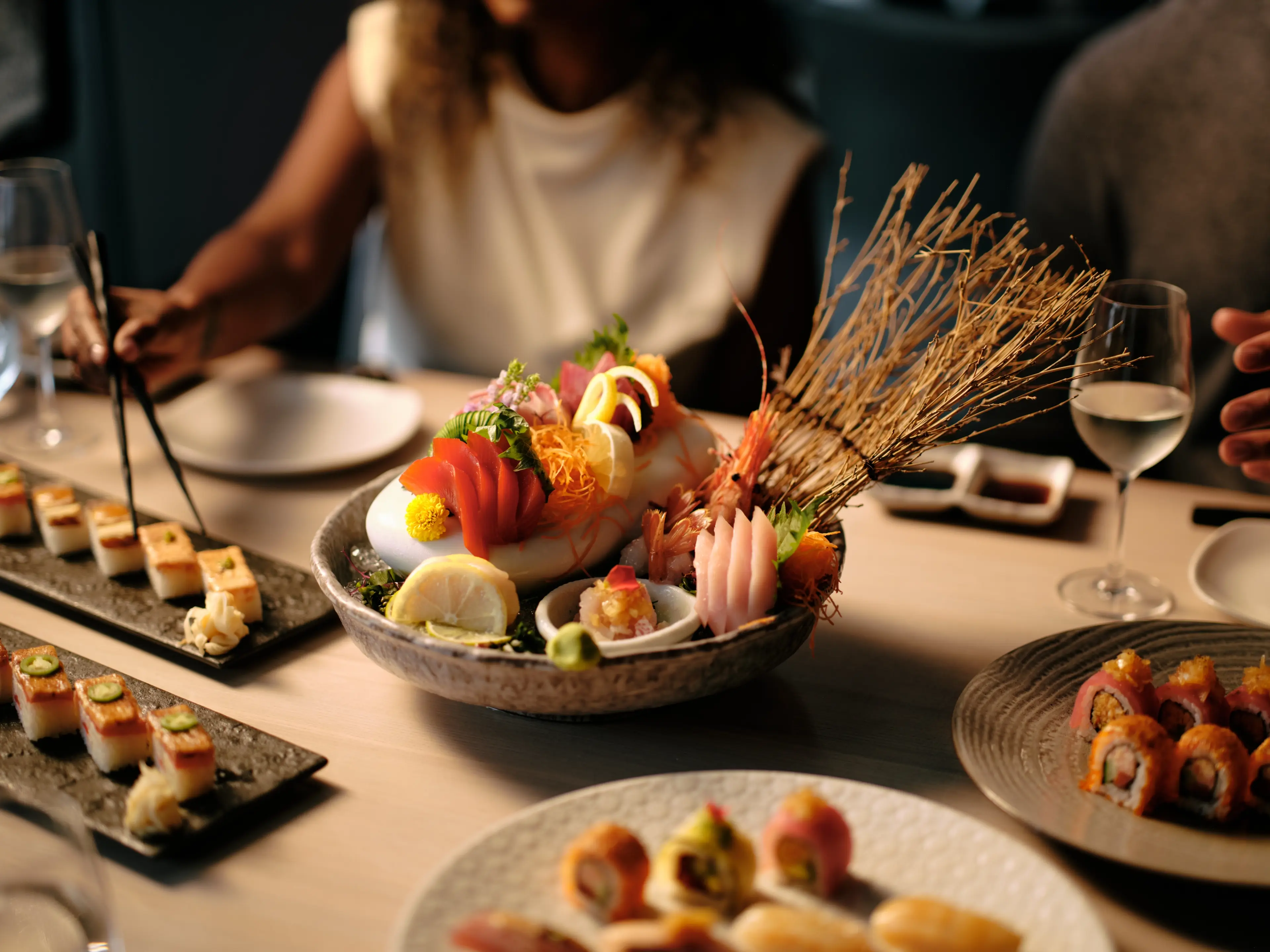 Dinner plates with sushi and fresh seafood at Miku in Vancouver.