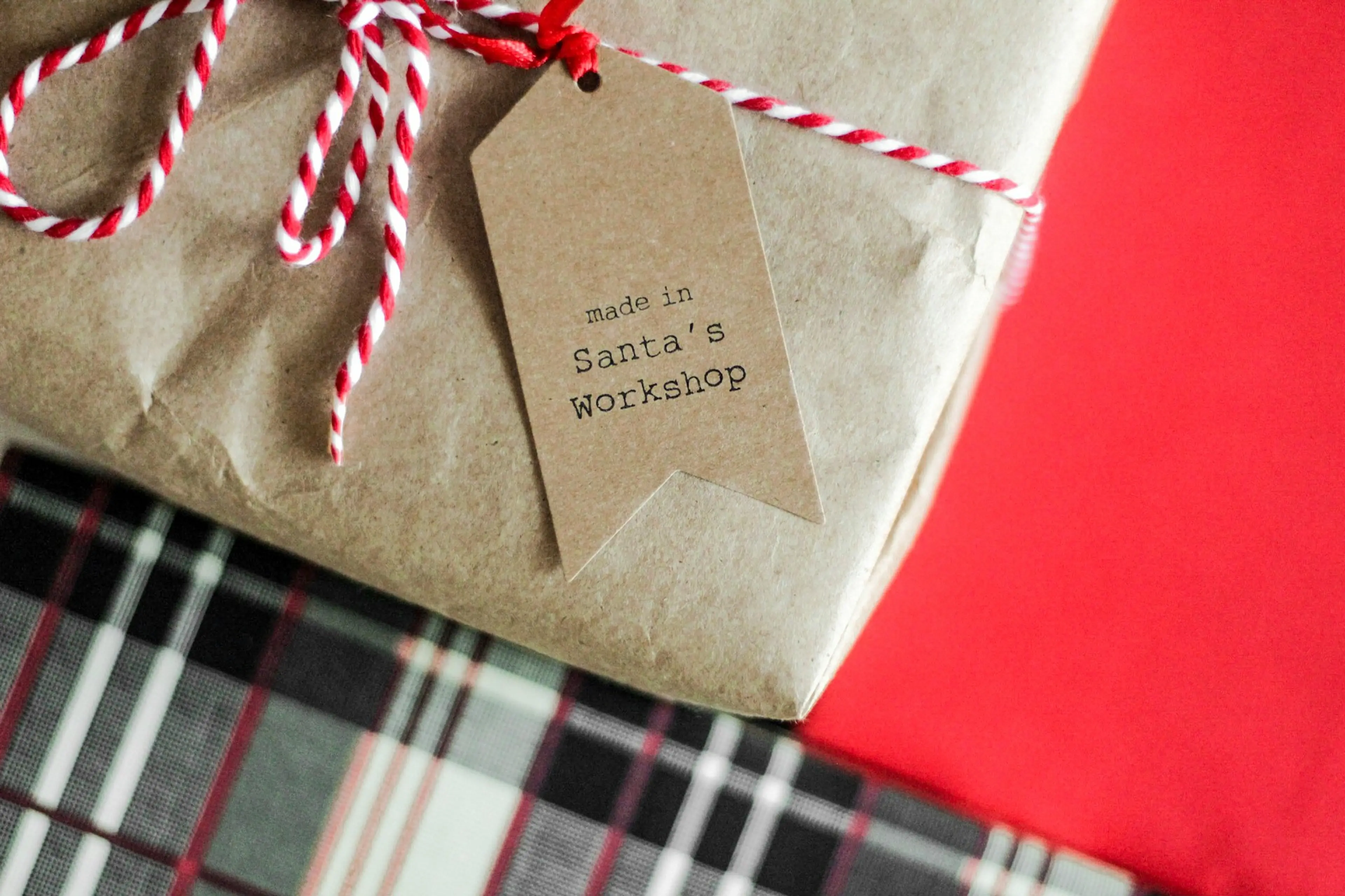 A gift wrapped in brown paper with a DIY gift tag.
