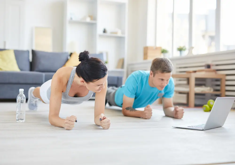Couple working out at home. Workout at home online yoga classes in Vancouver