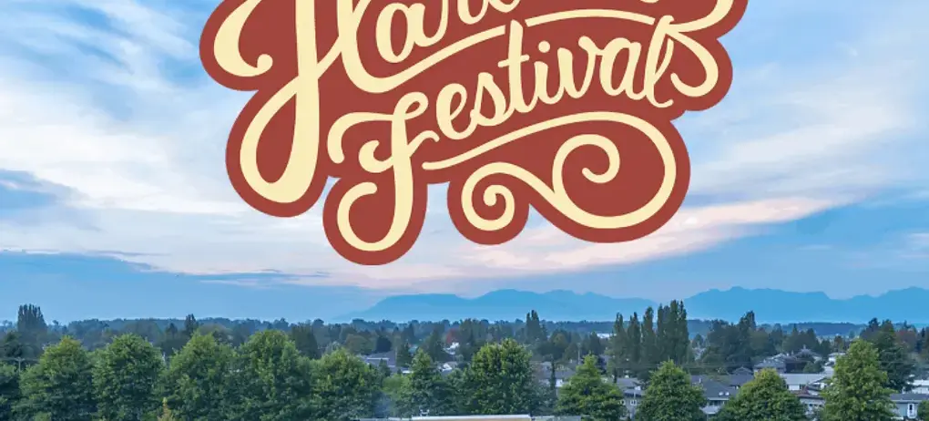 Large outdoor crowd at a festival with tents and a stage under a blue sky with text Barnside Brewing Co Harvest Festival
