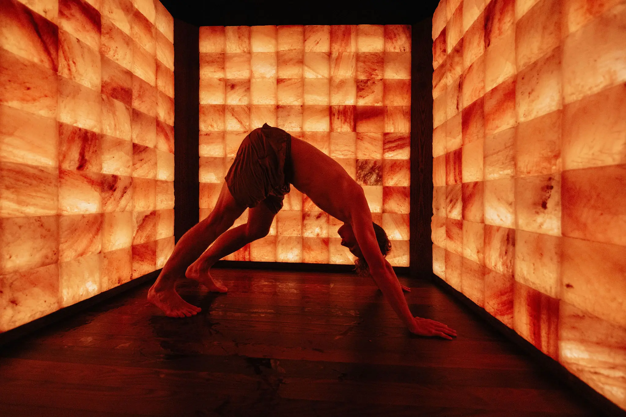 A person stretching in a wellness room at Circle Wellness in Vancouver.