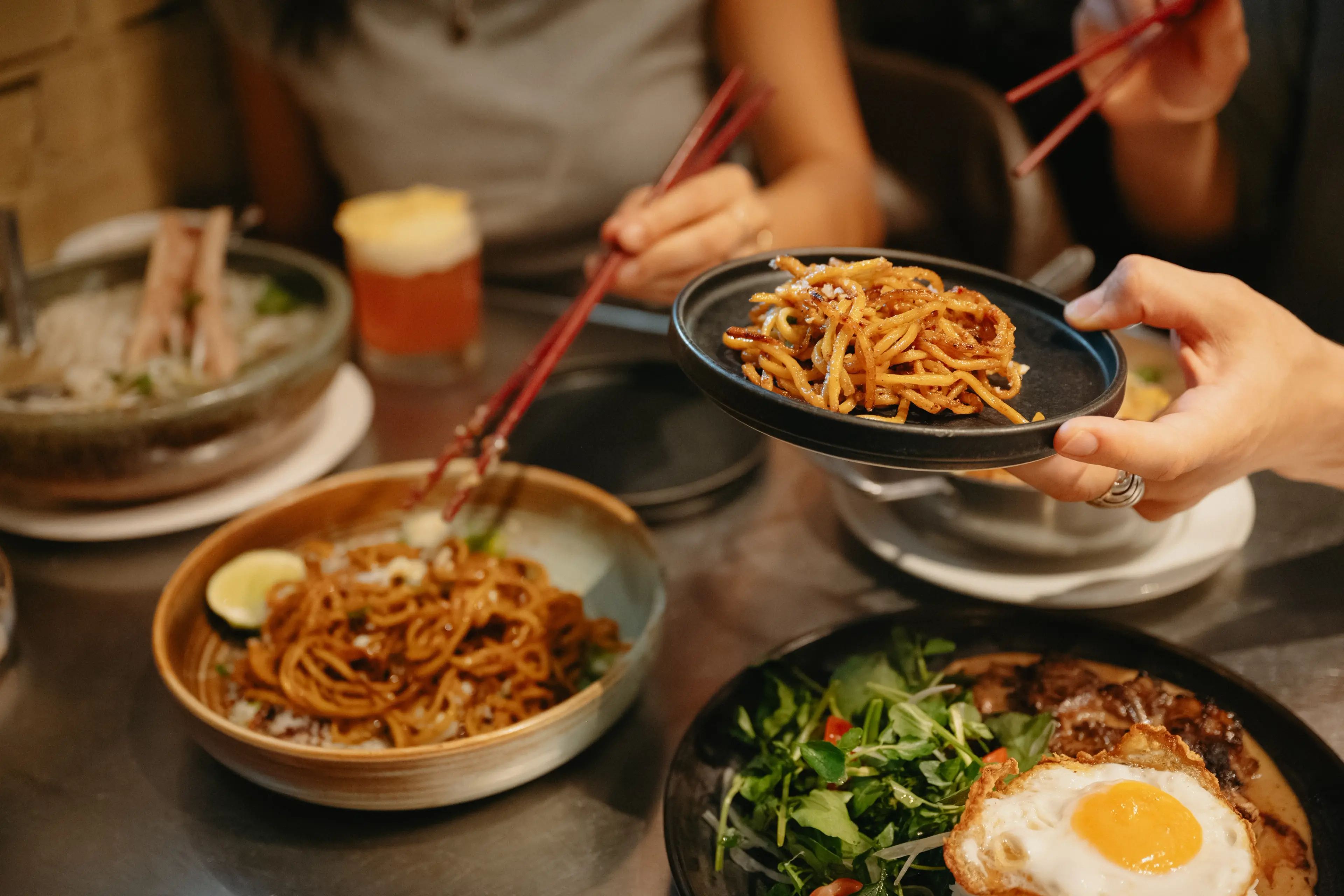 A table with a varierty of dishes at the Lunch Lady in Vancouver.