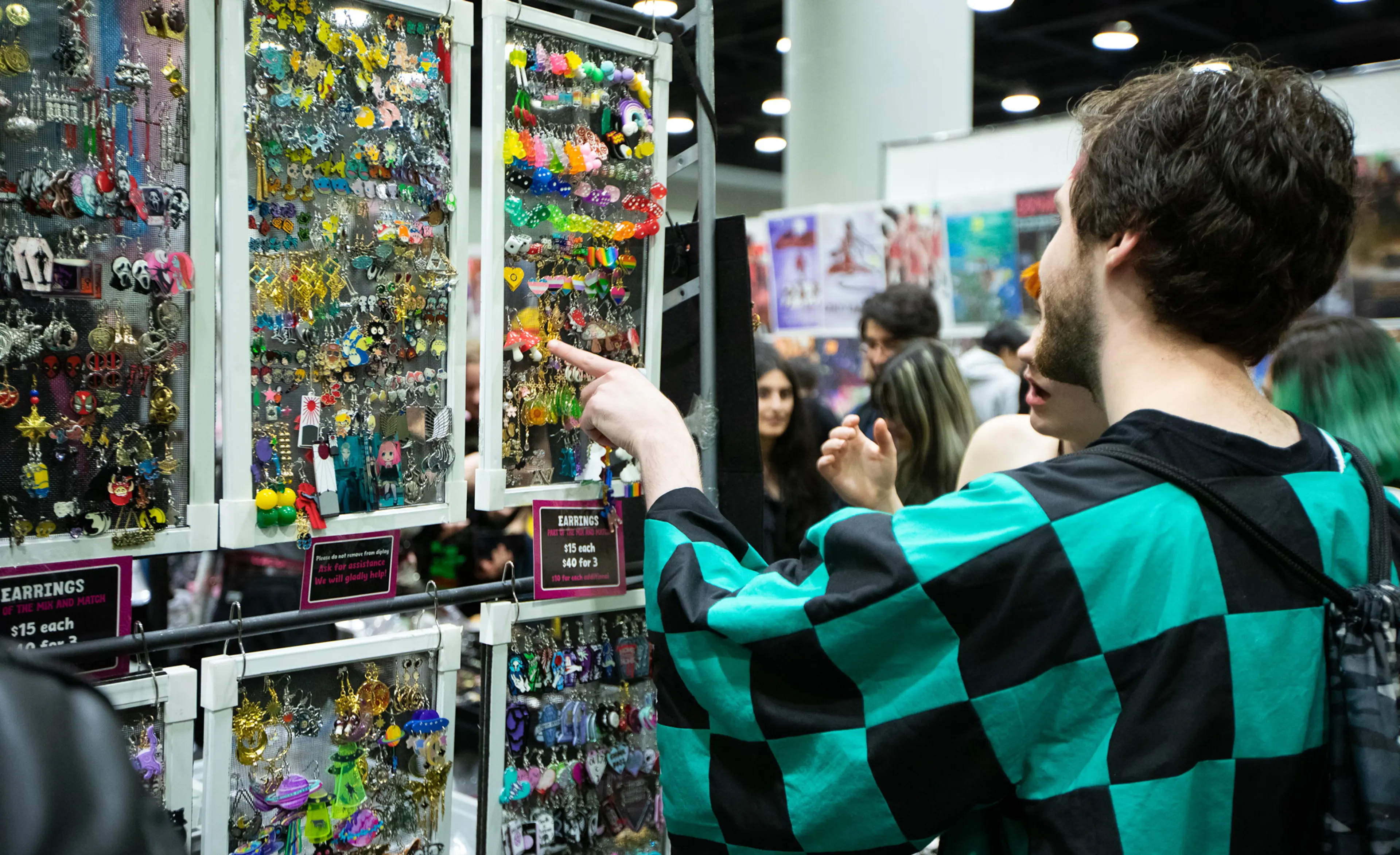 Visitors at the FanExpo shopping at different vendor stands.