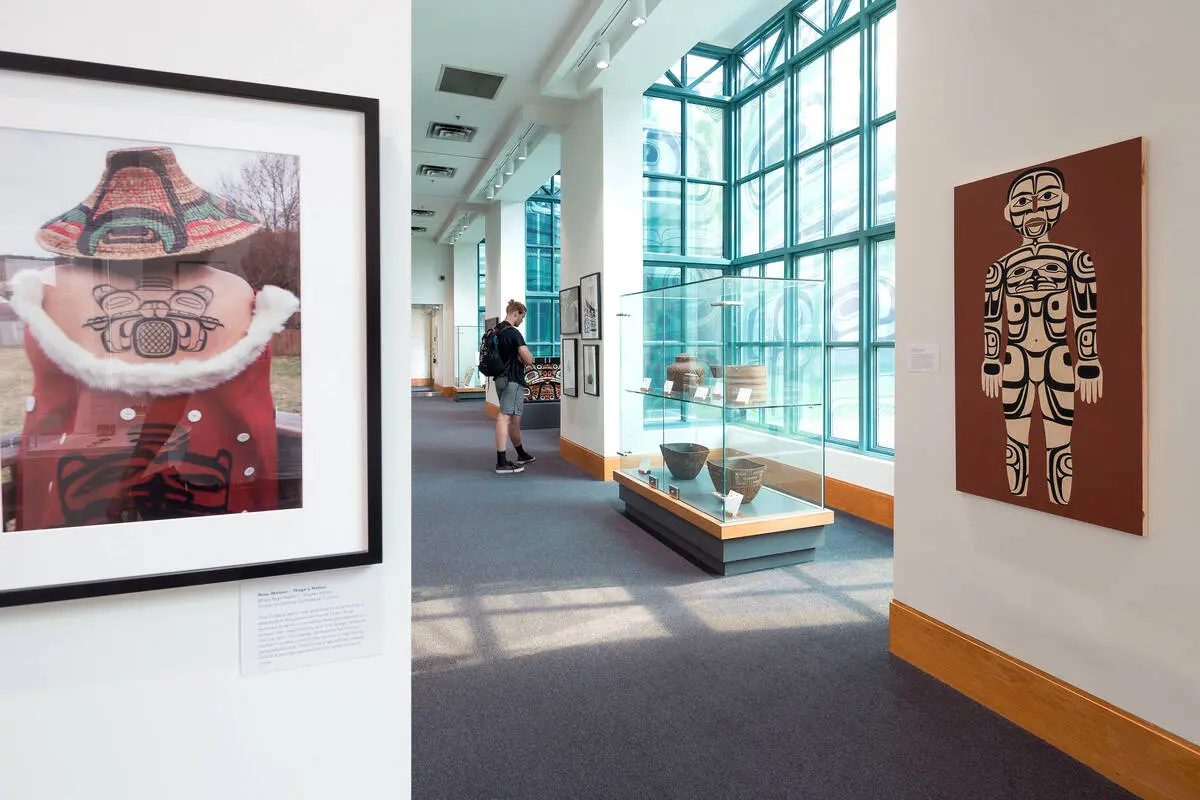 A visitor admires art at the Bill Reid Gallery