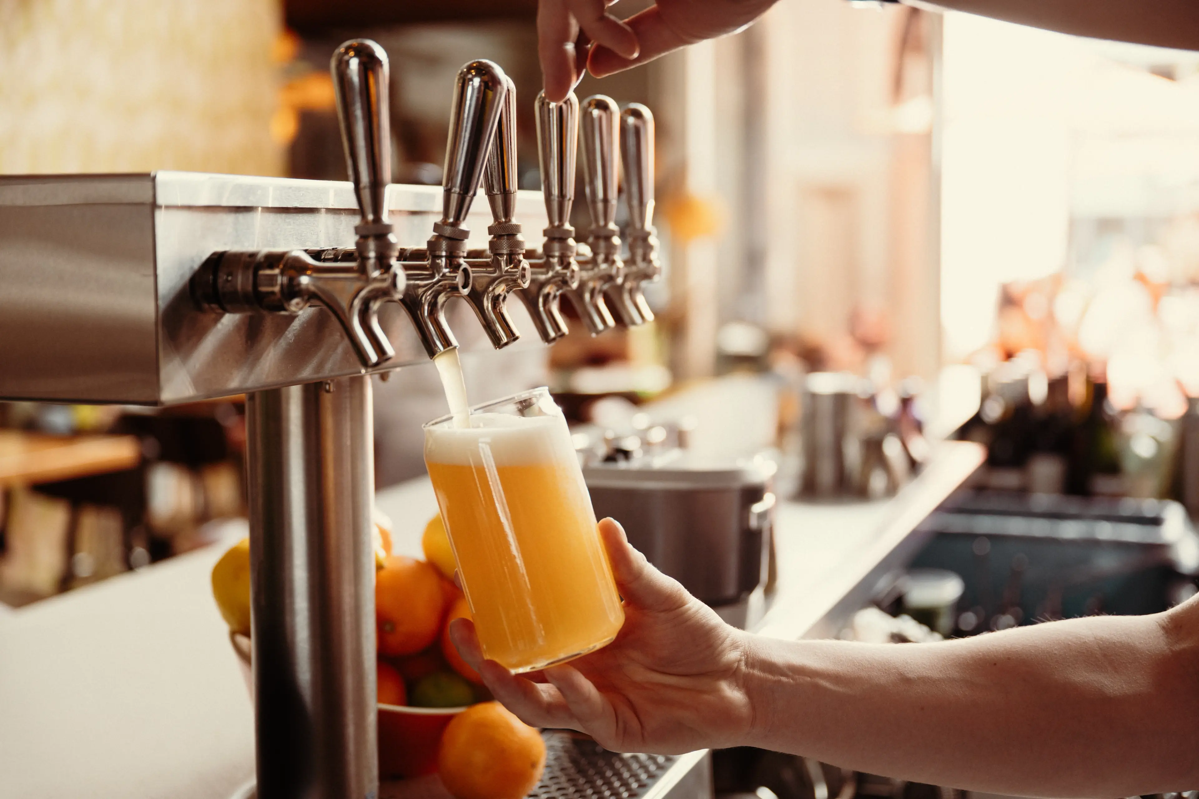 Beer being poured into a glass.