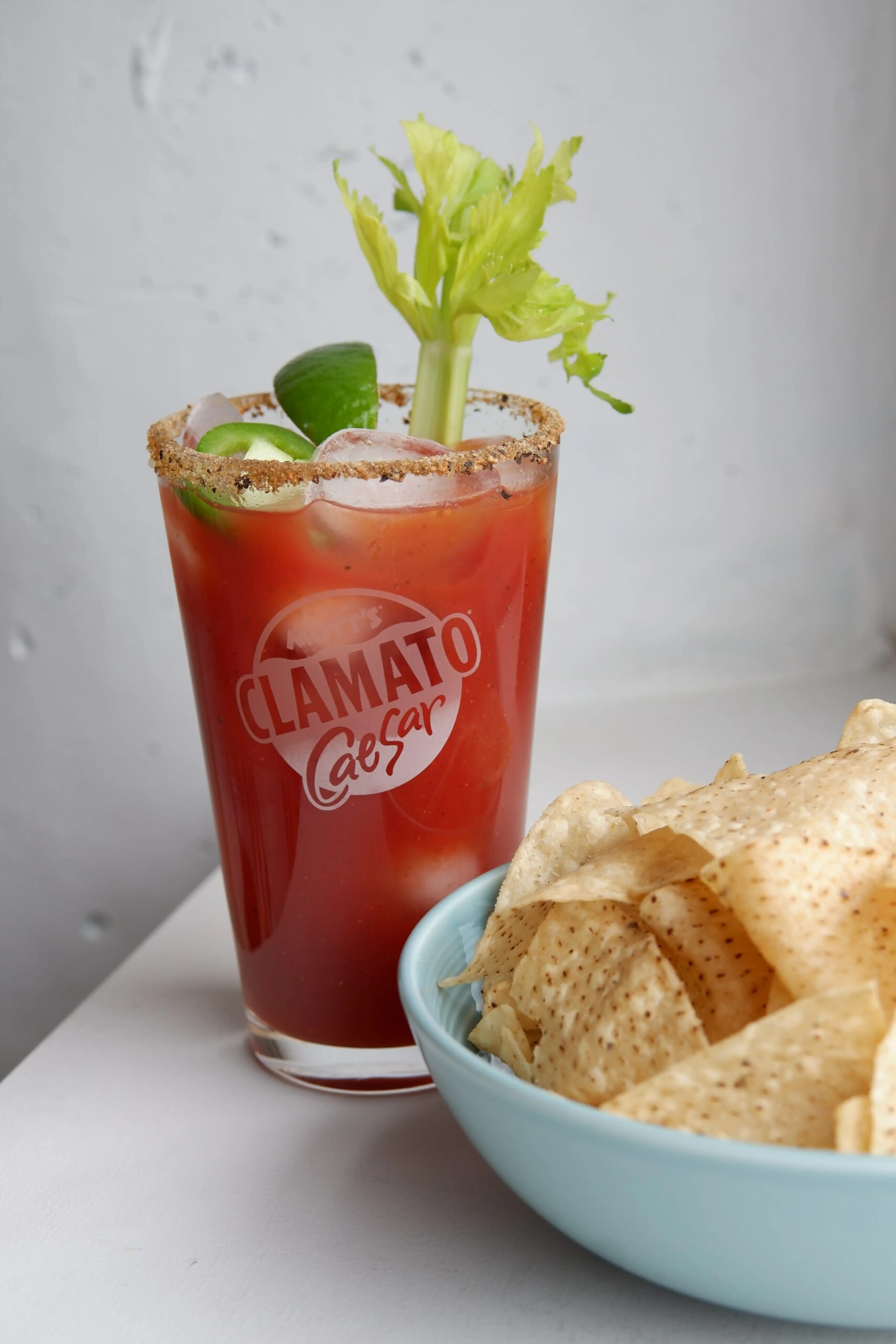 Caesar cocktail in a tall glass with celery
