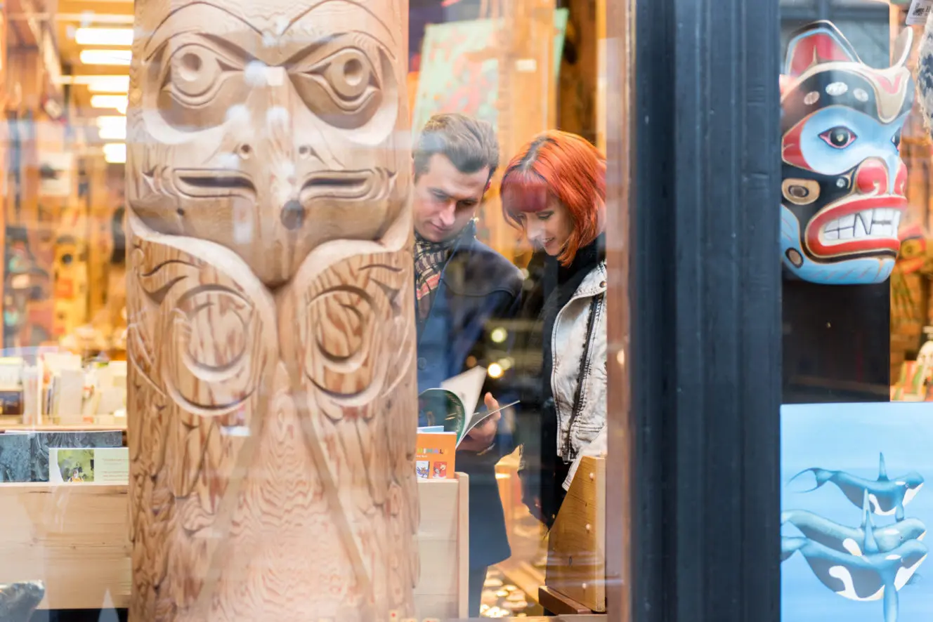 Two people at an Indigenous Gallery in Gastown.