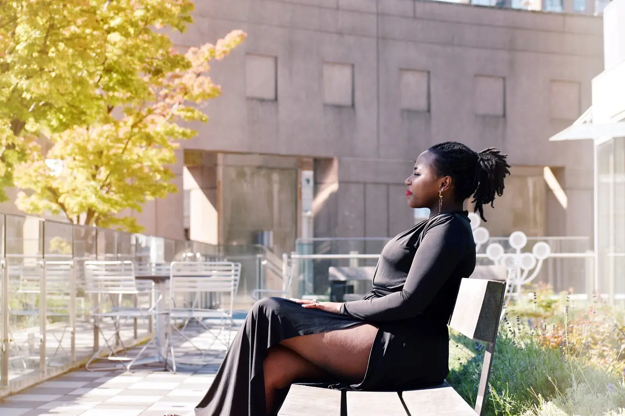 A woman sits on a bench in the rooftop garden at the Vancouver Central Library