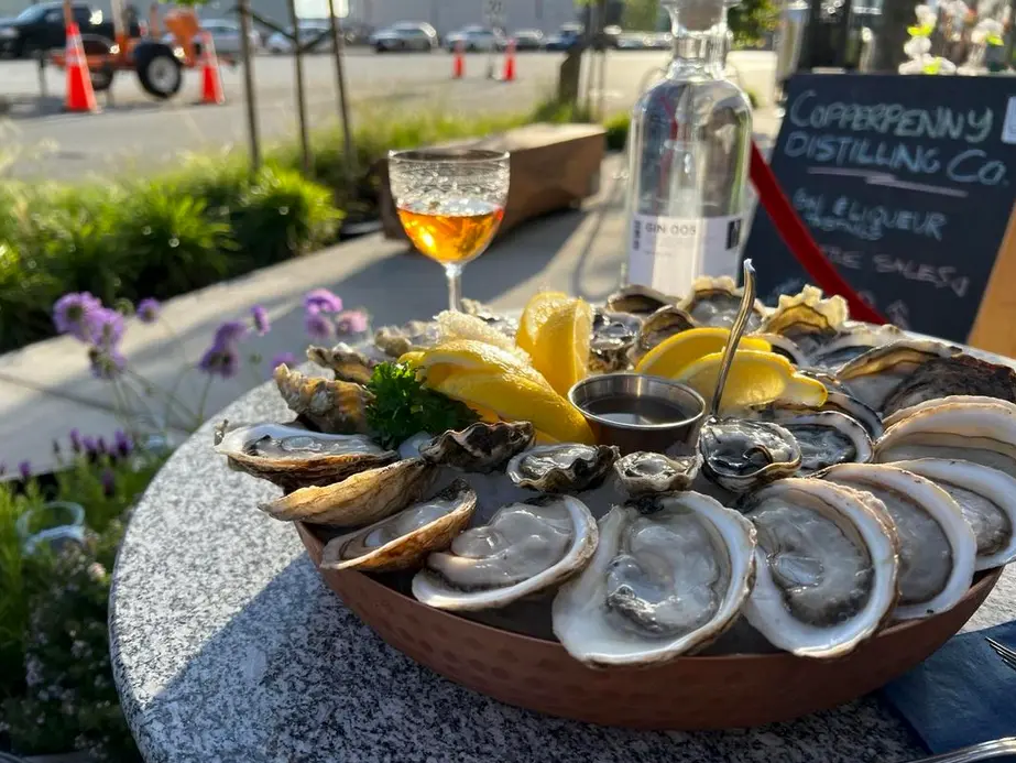 Oysters and gin on the patio at Copperpenny Distilling in North Vancouver