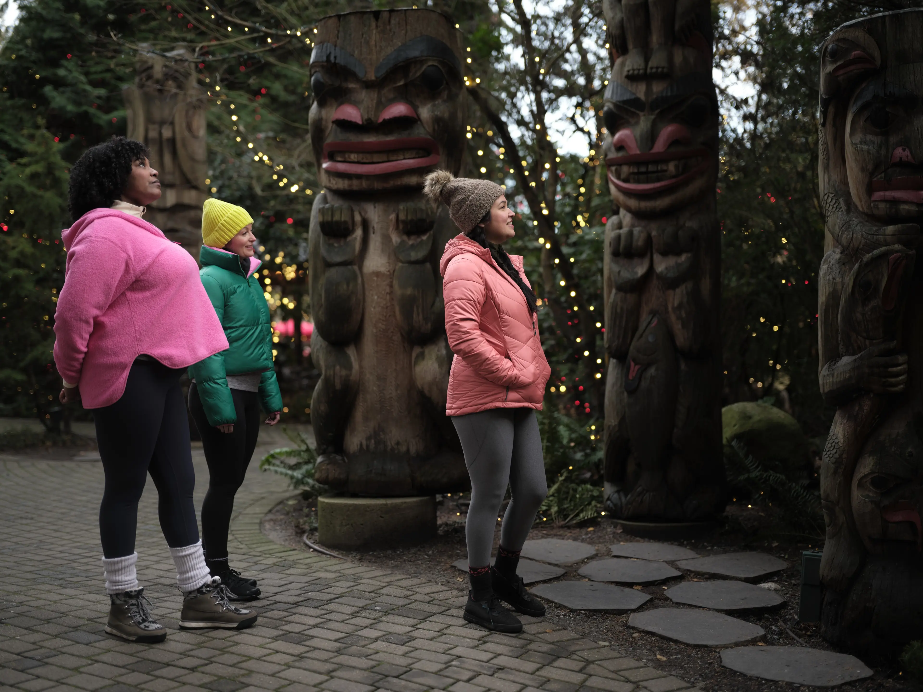 Three friends at the Capilano Suspension Bridge Park in the winter.