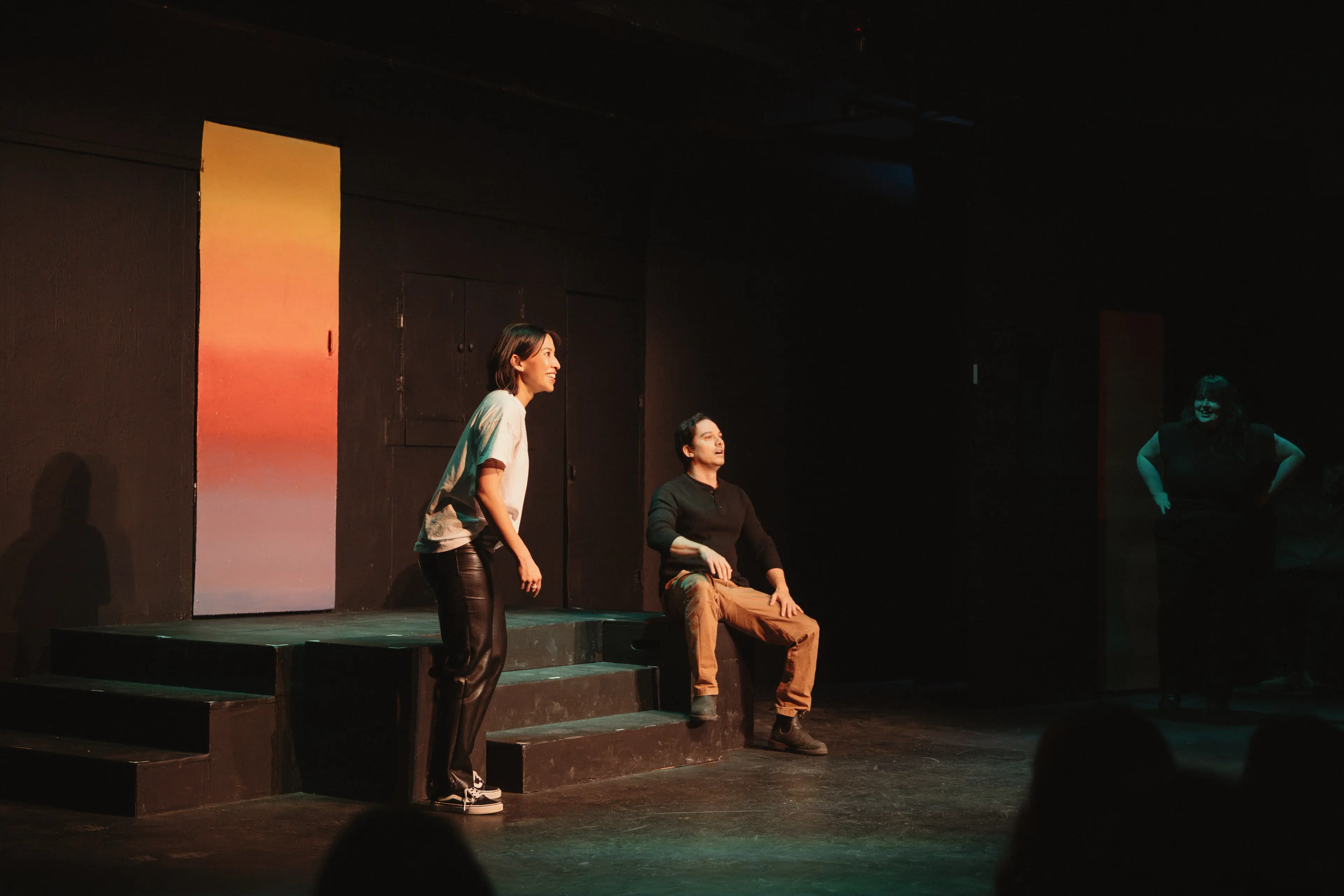 Two people on stage performing at the Improv Theater in Vancouver.