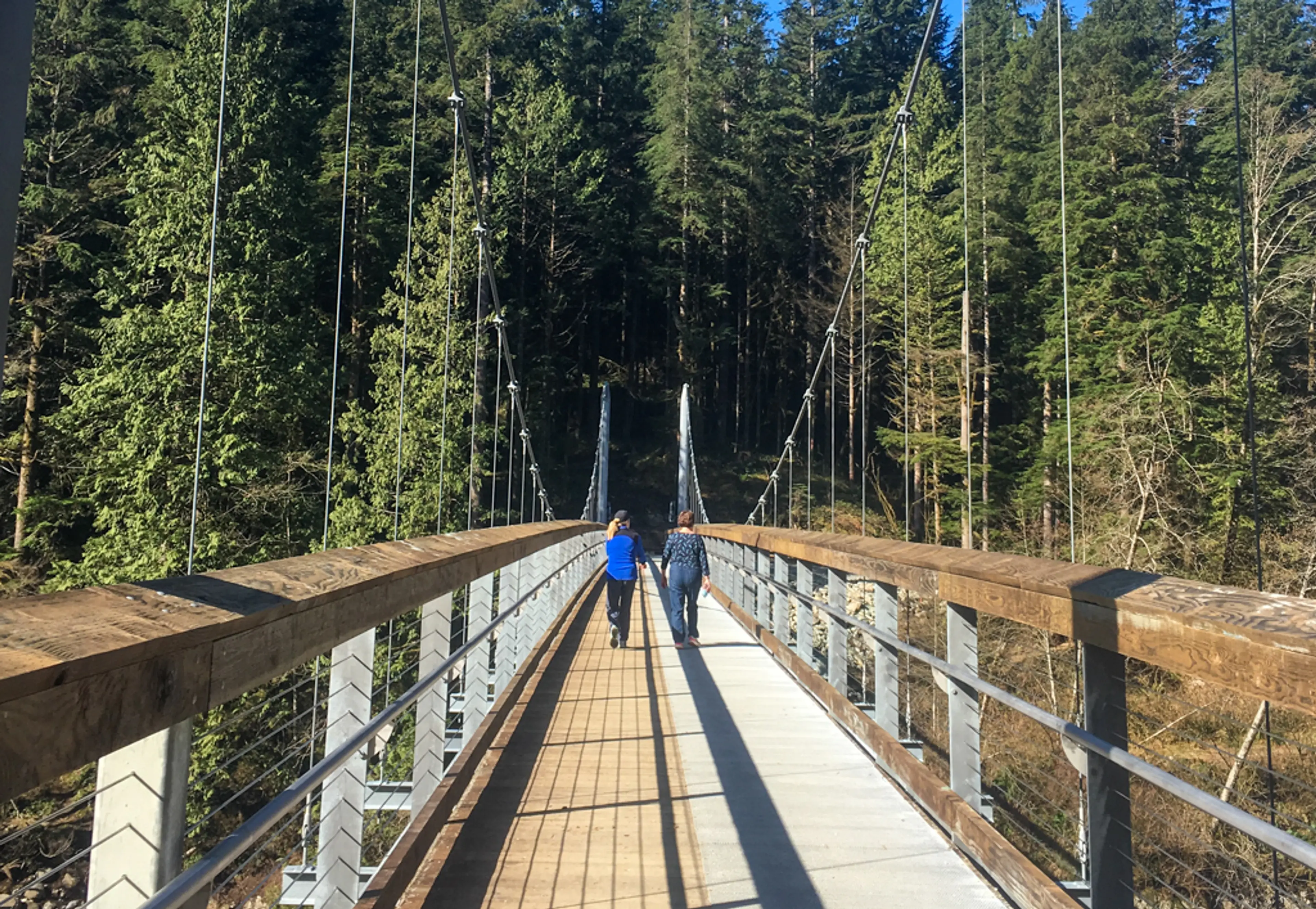 Walking across the new Twin Bridges suspension bridge in North Vancouver