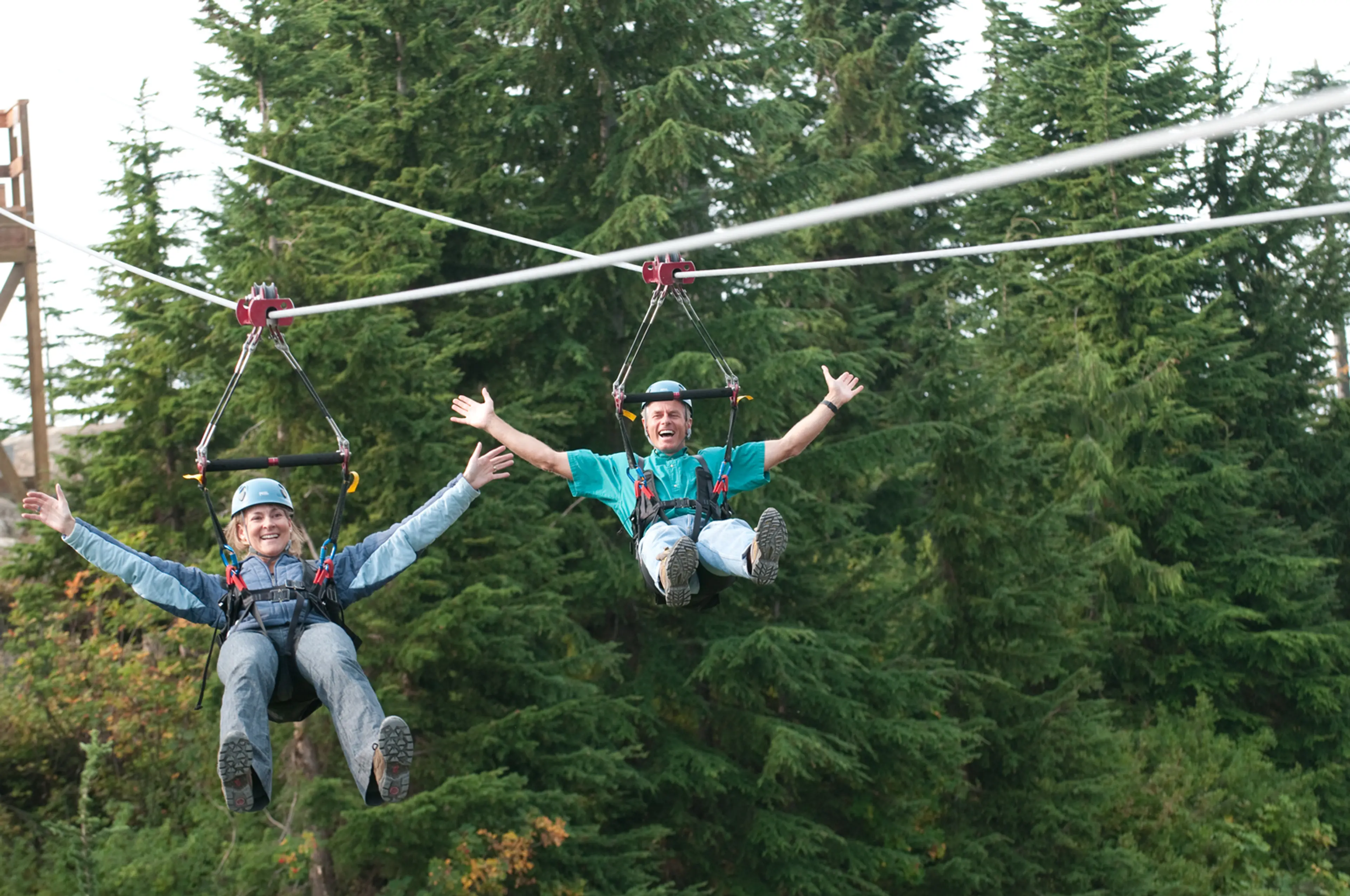 Two people ride the zipline at Grouse Mountain in Vancouver