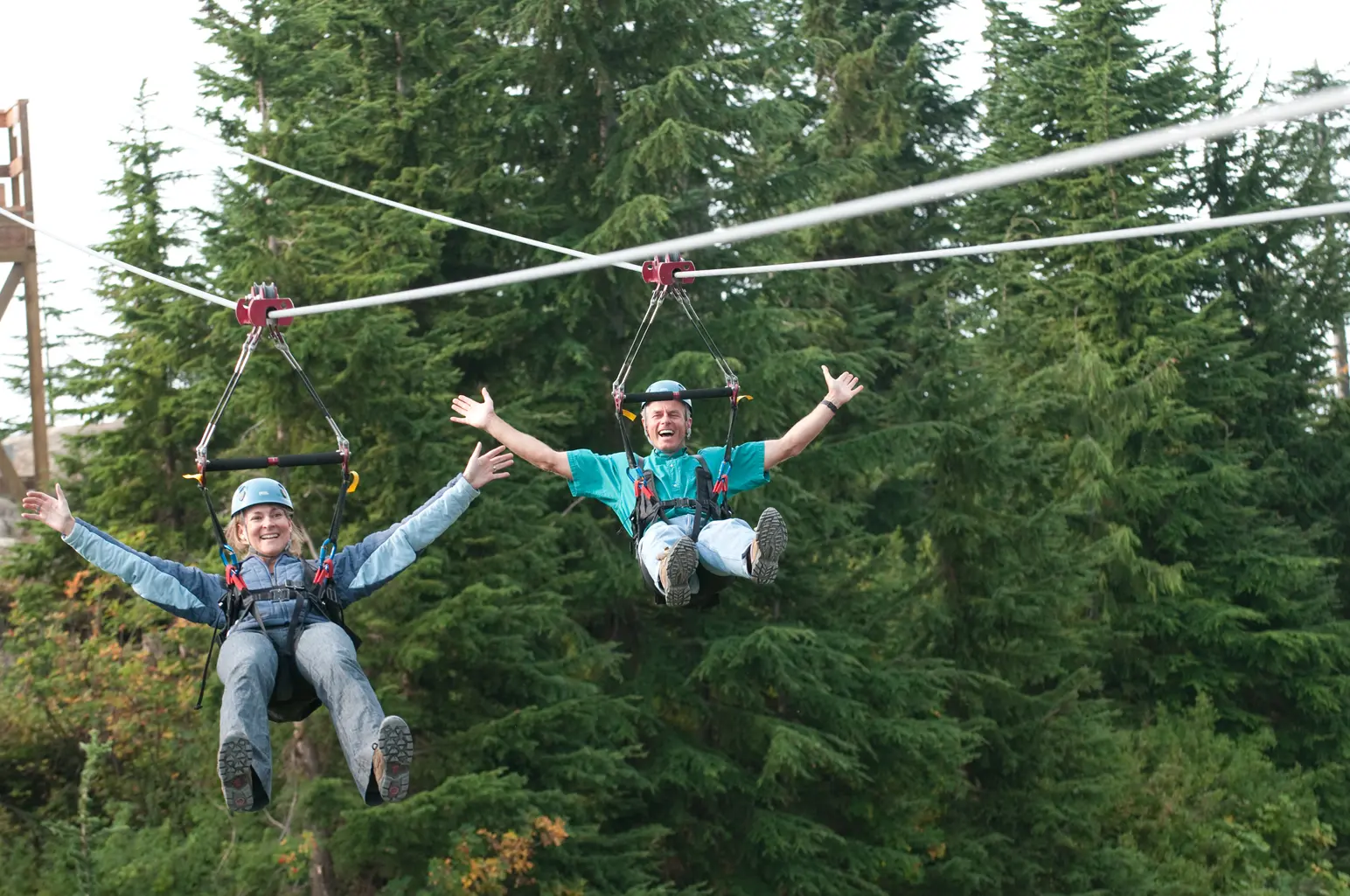 Two people ride the zipline at Grouse Mountain in Vancouver