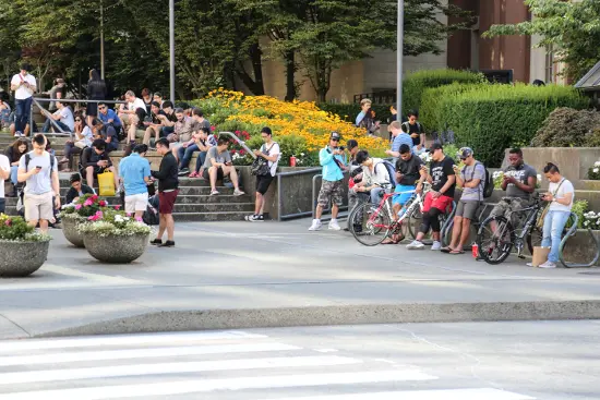 Pokémon Go devotees congregate across the street from Waterfront Centre between Pokémon Go Lure spots.