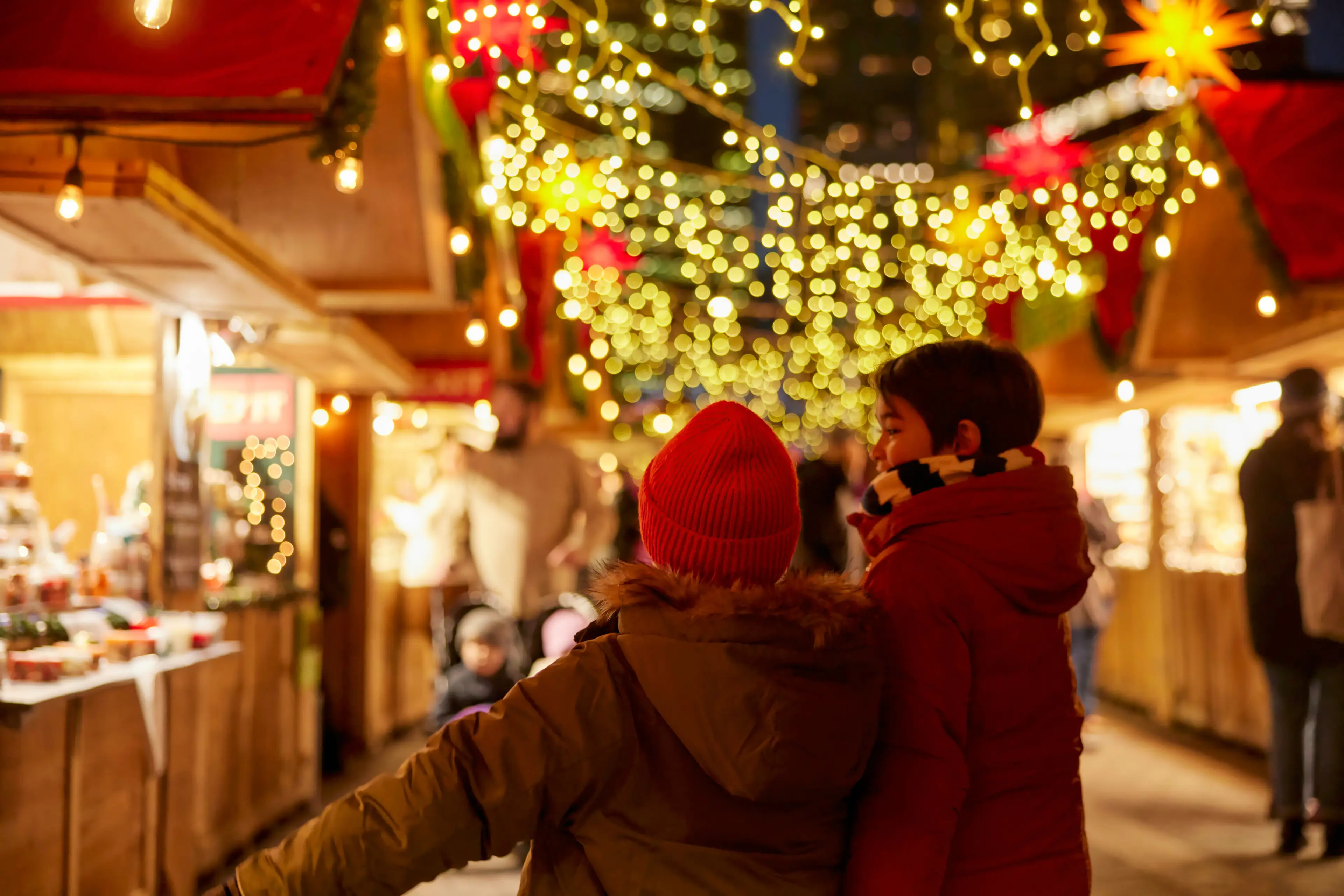 Two kids strolling through the Vancouver Christmas Market
