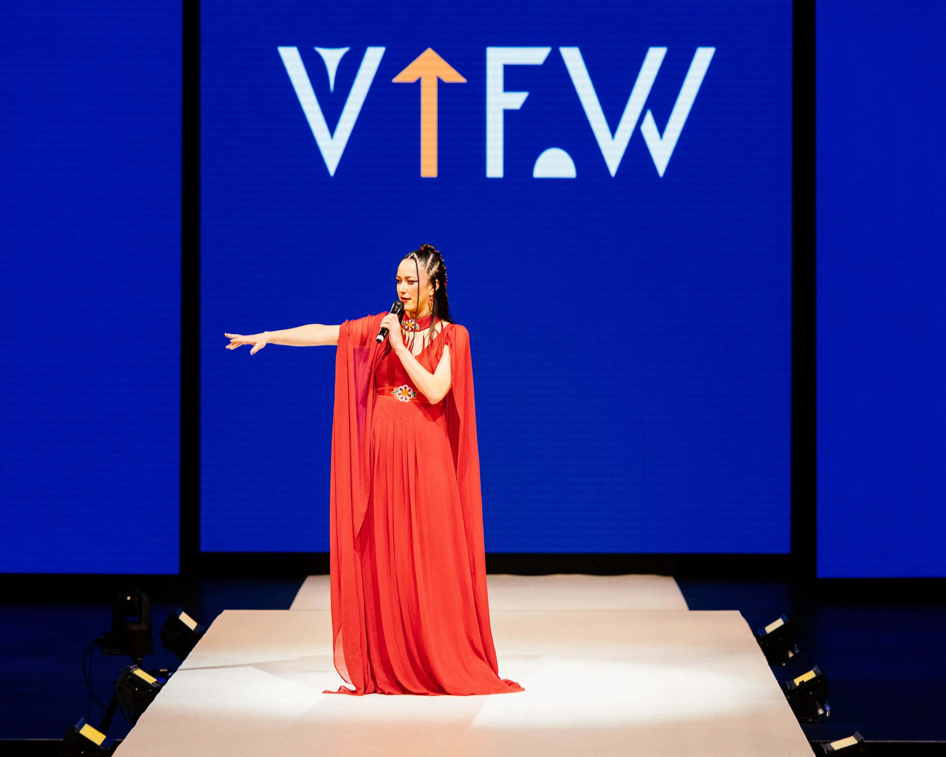 VIFW Founder Joleen Mitton on the runway, speaking