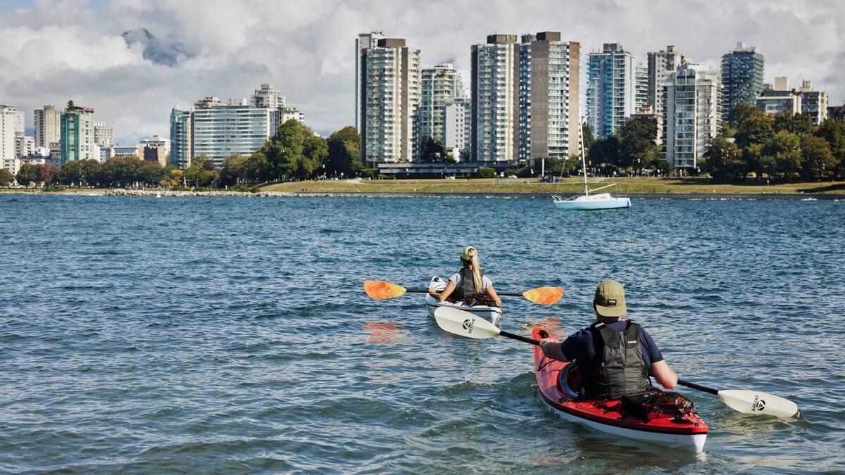 Two kayakers at the entrance to False Creek.