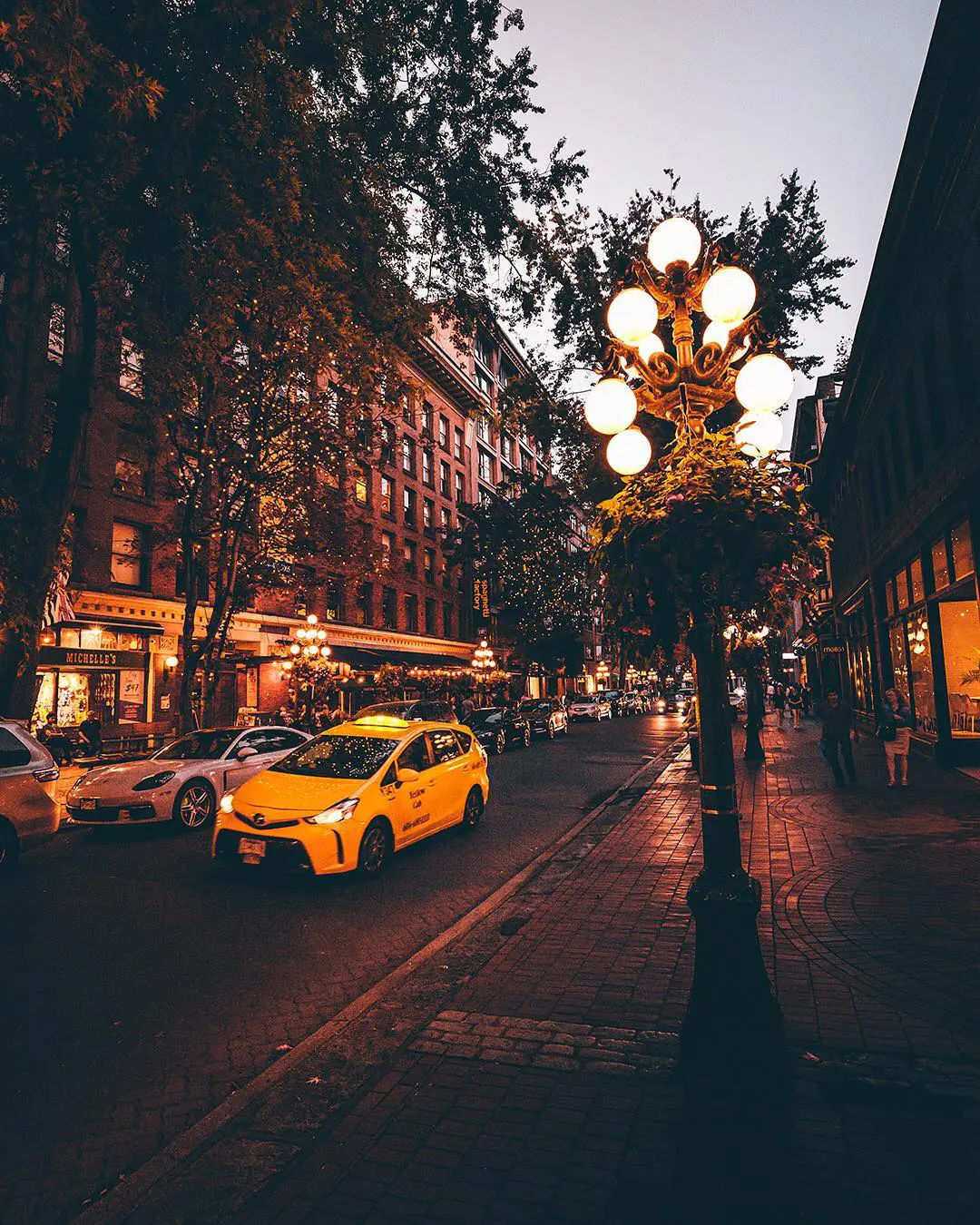 Taxi driving through Gastown at dusk