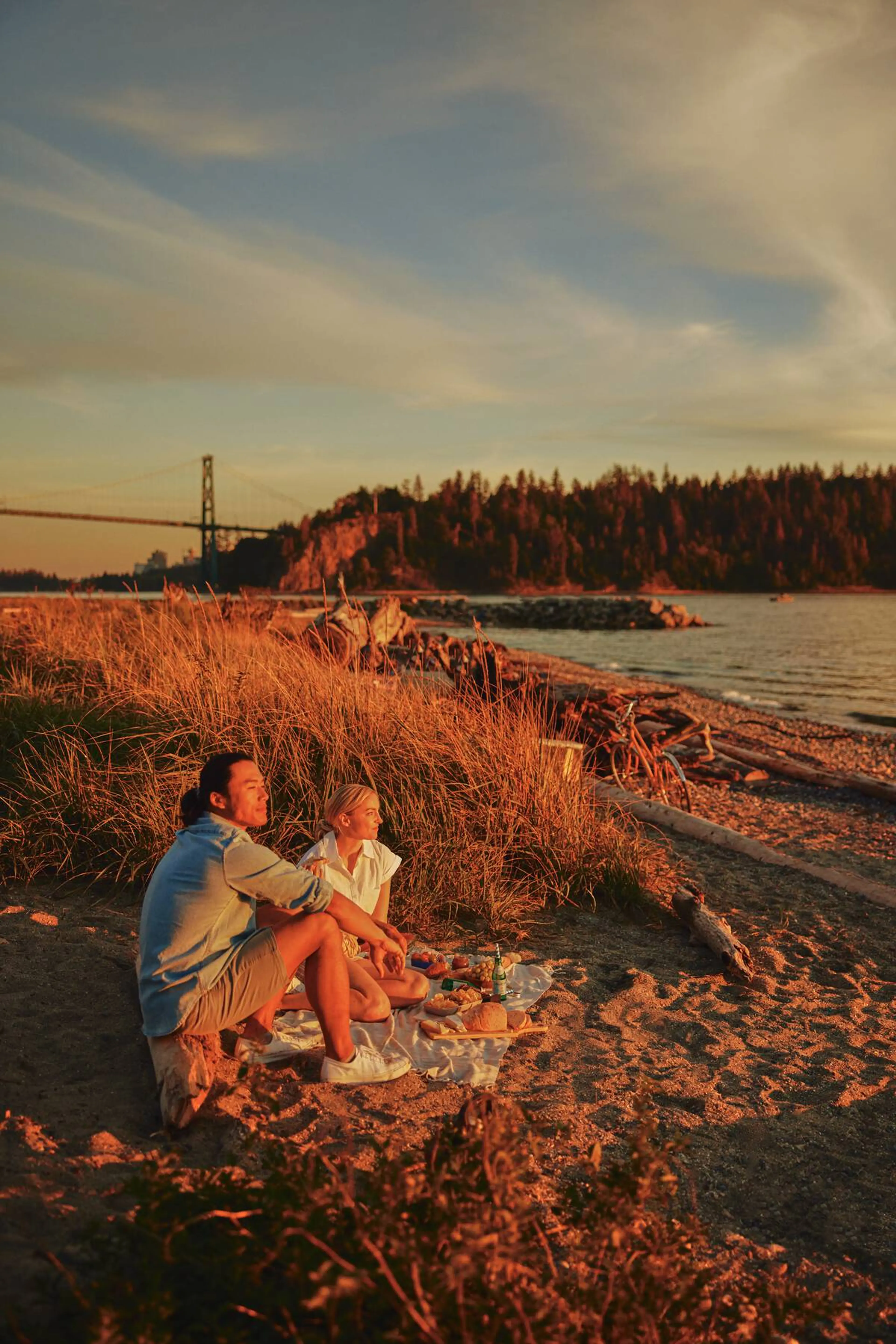 A couple picnics at Ambleside Park in West Vancouver