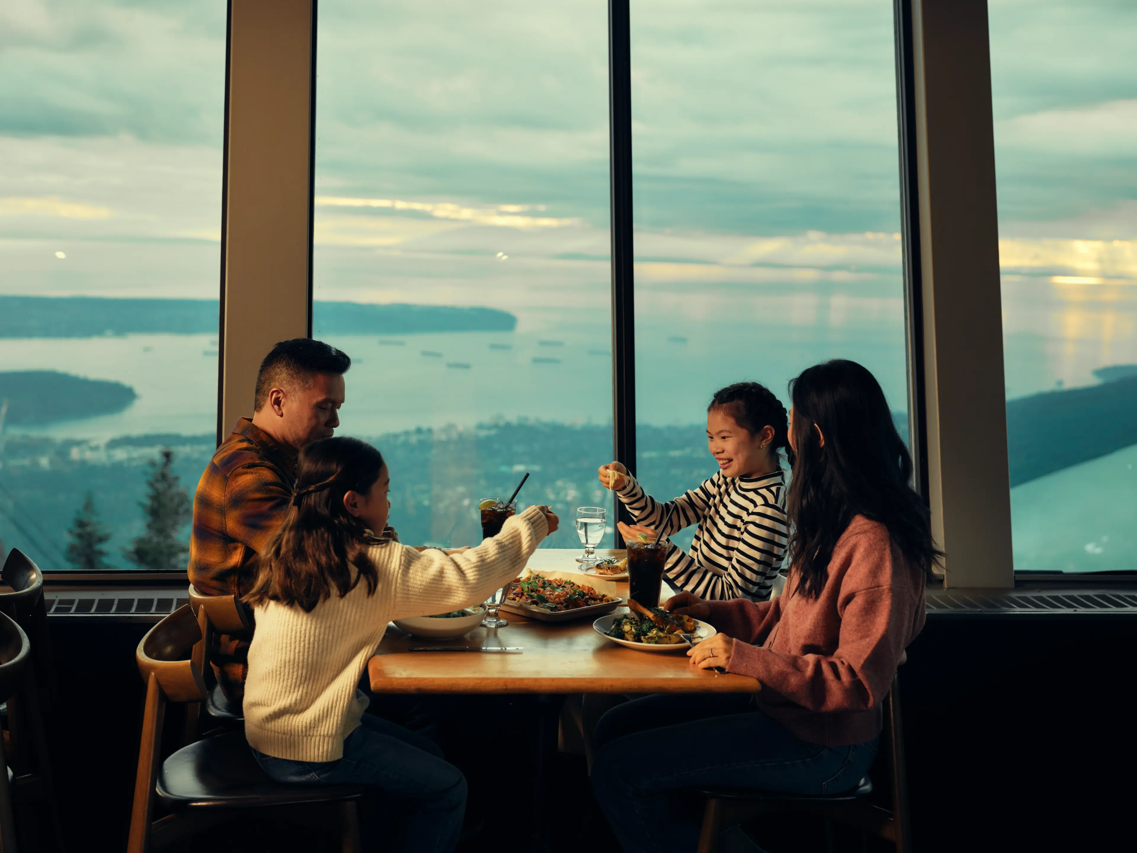 Family eating and drinking at Grouse Mountain