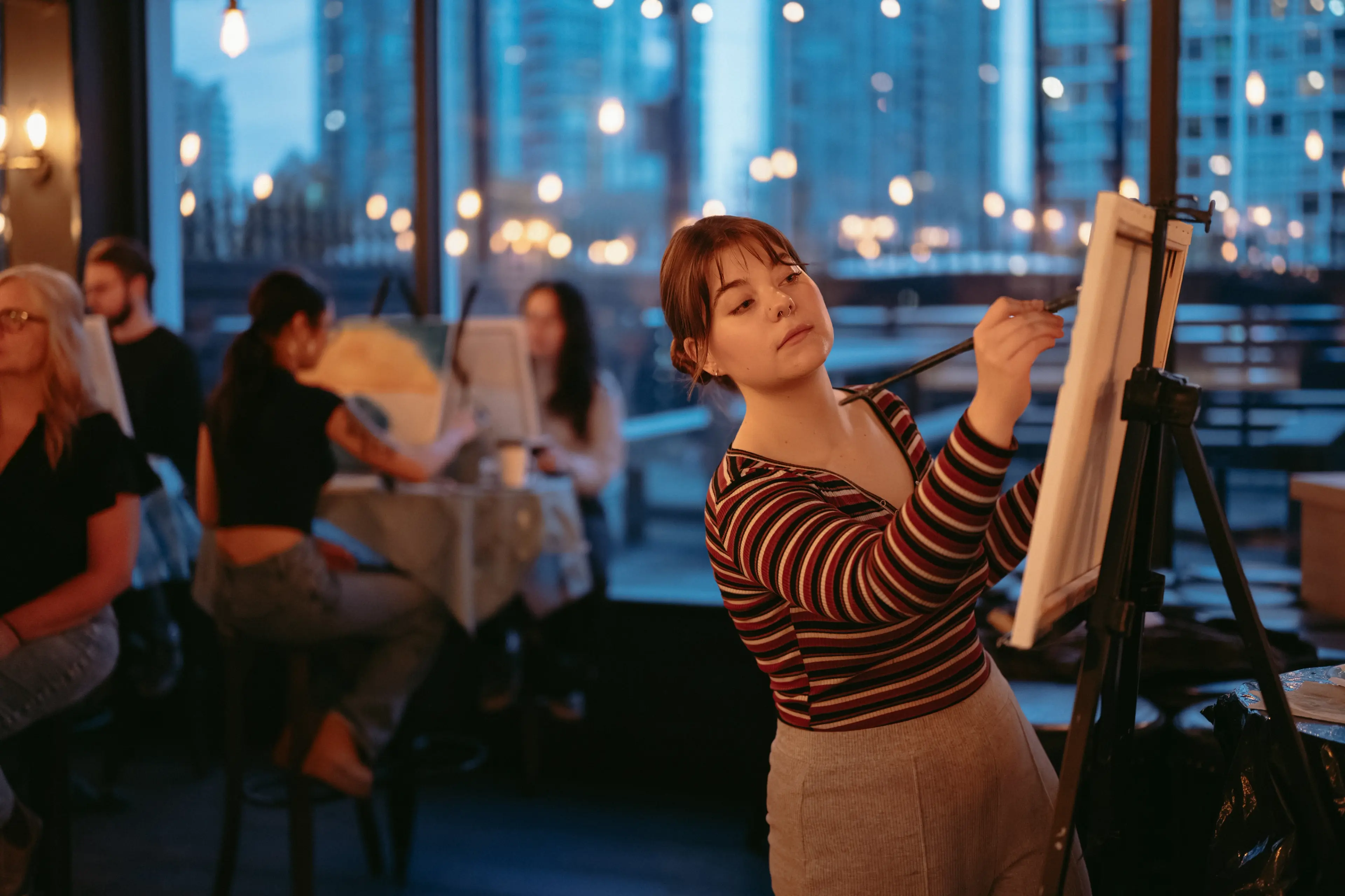 An instructor painting at the Paint-and-sip night at the Ventura Room, Vancouver.