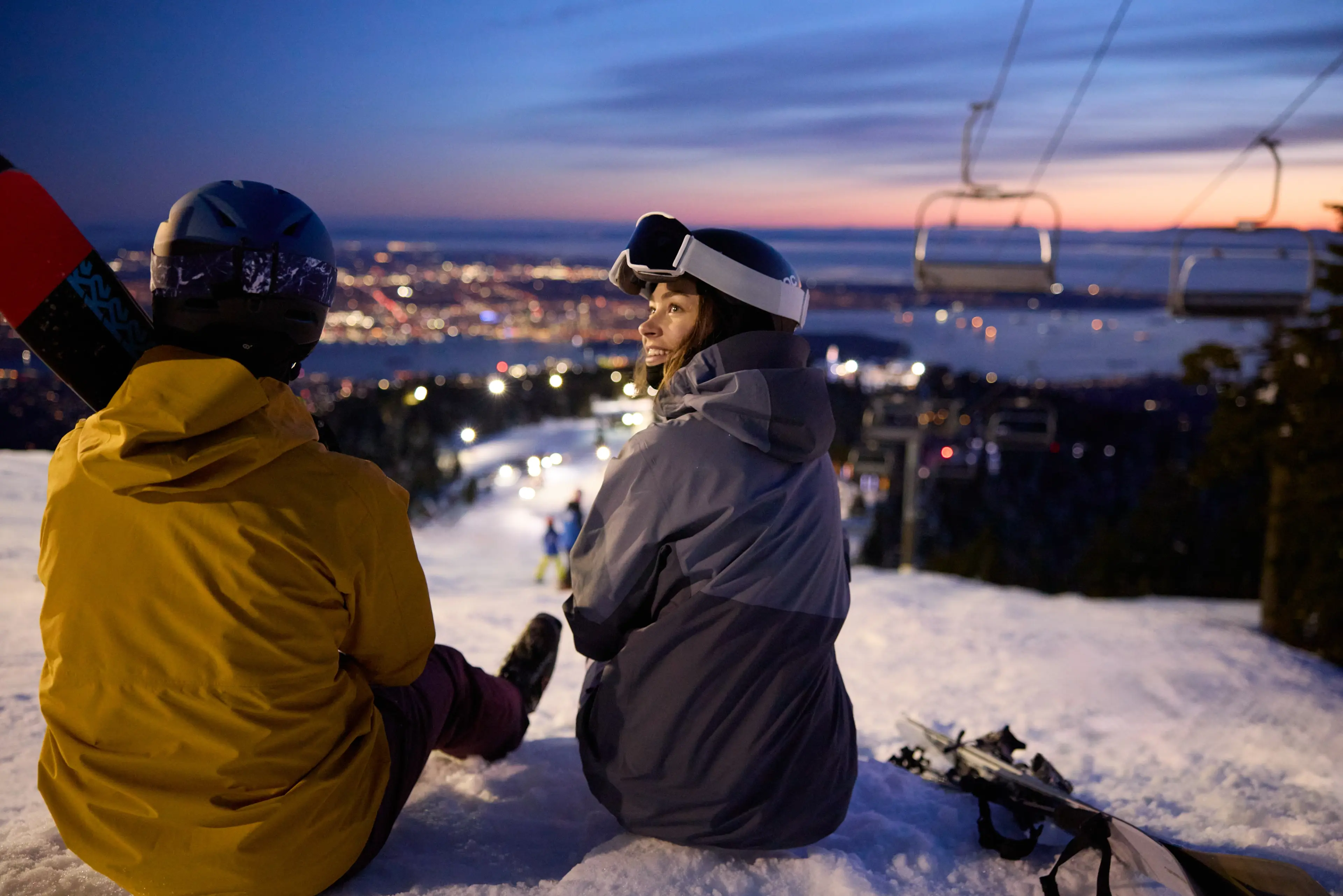 People enjoying the view while night skiing on Grouse Mountain in North Vancouver.