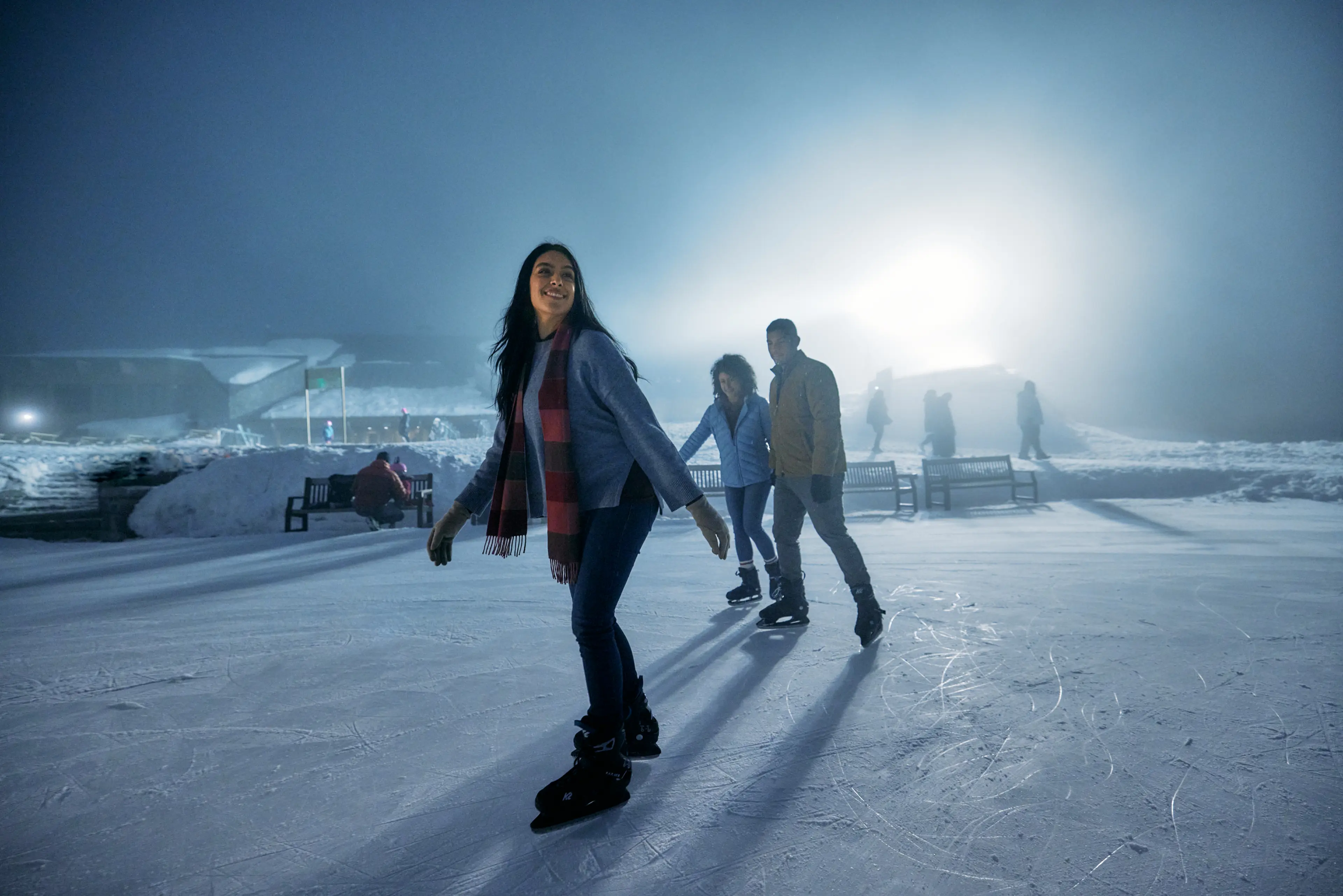 A group on friends ice skating on Grouse Mountain in North Vancouver.