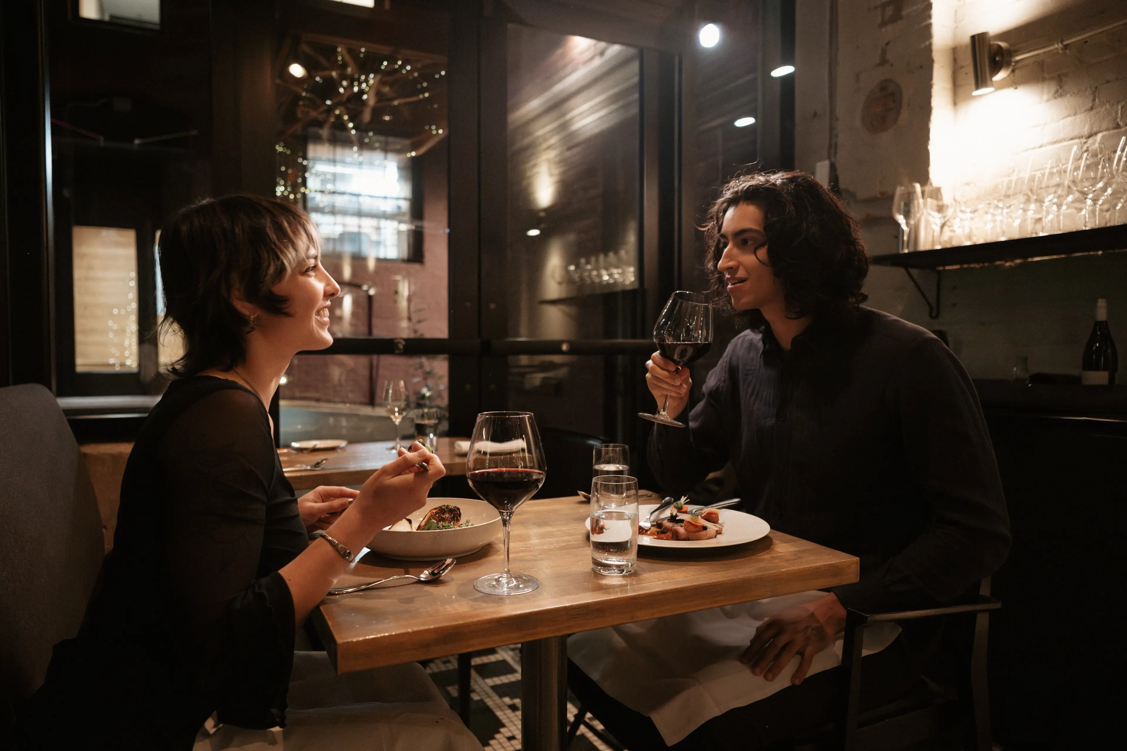 A couple dining at L’Abattoir in Vancouver.