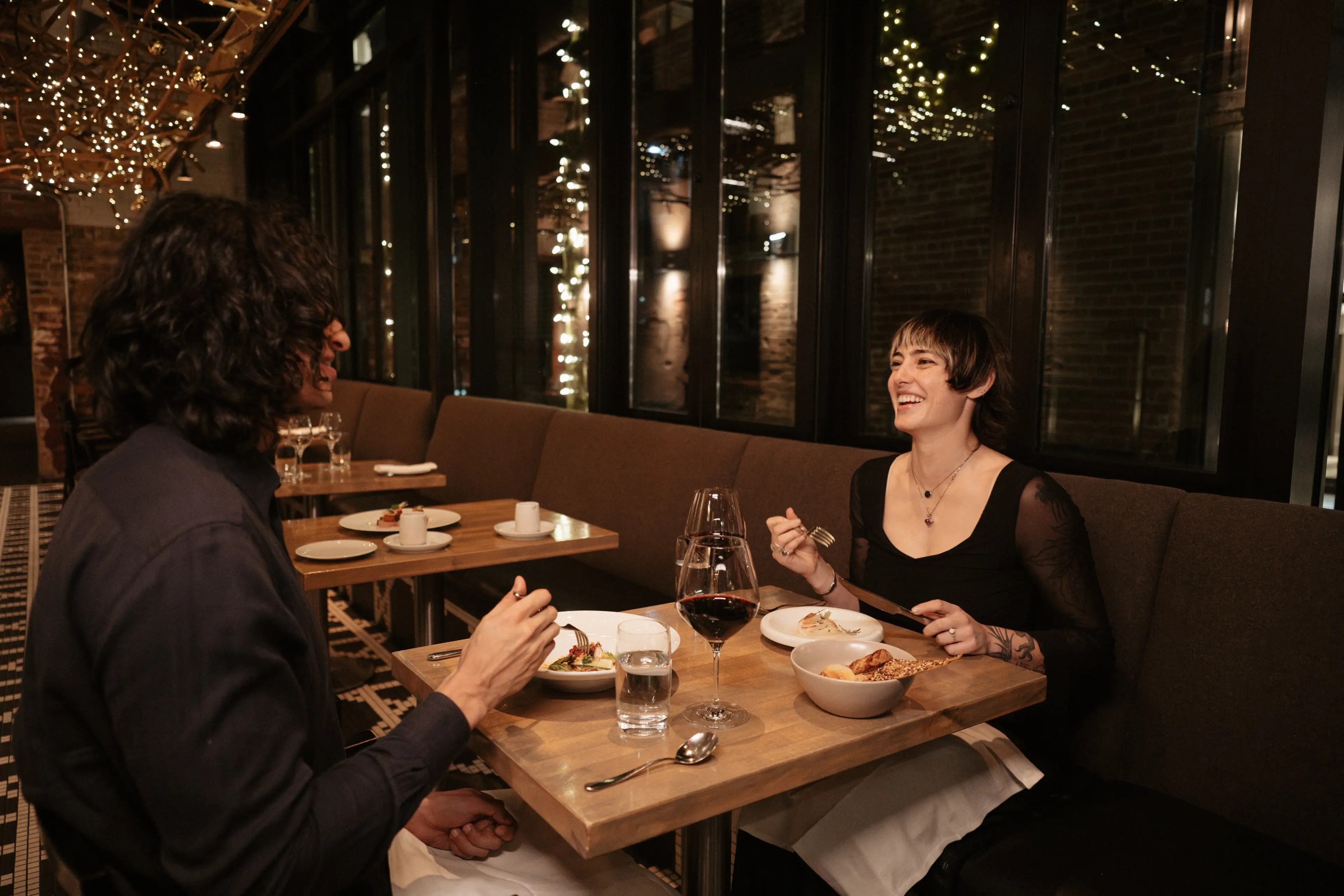 A couple dining at L'Abattoir in Gastown, Vancouver.