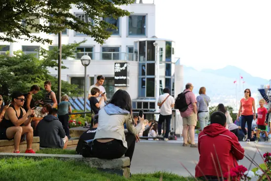 Pokemon Go fans gather between Pokemon Lure Stops at The Vancouver Club, the Jumping Jack art installation, and Waterfront Centre.