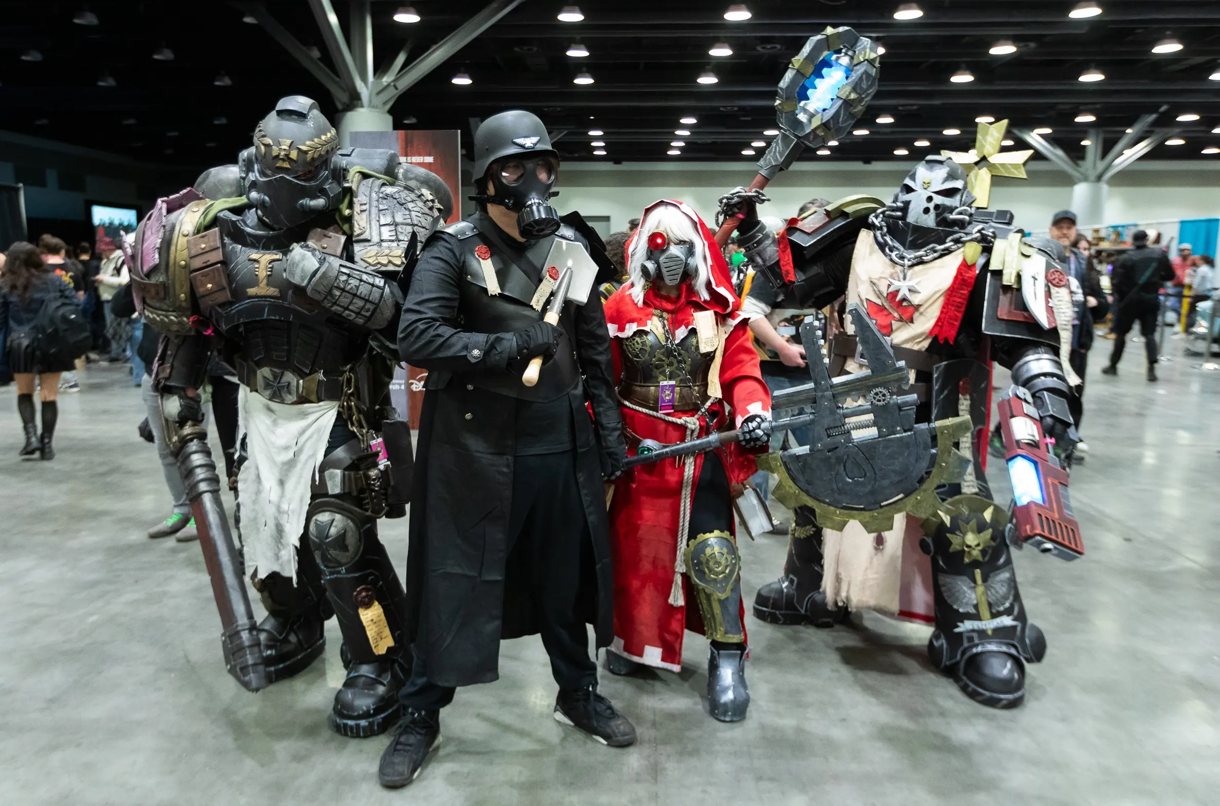 People in costumes posing at the Fan Expo in Vancouver.